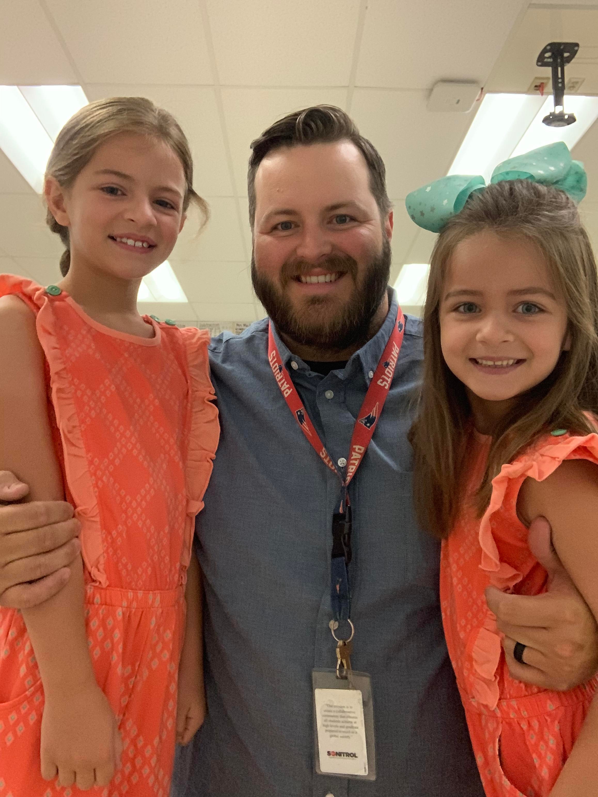 John Stepp with his daughters during his final first day of school as a teacher. He left teaching last year and is now selling real estate. Photo courtesy of Stepp.