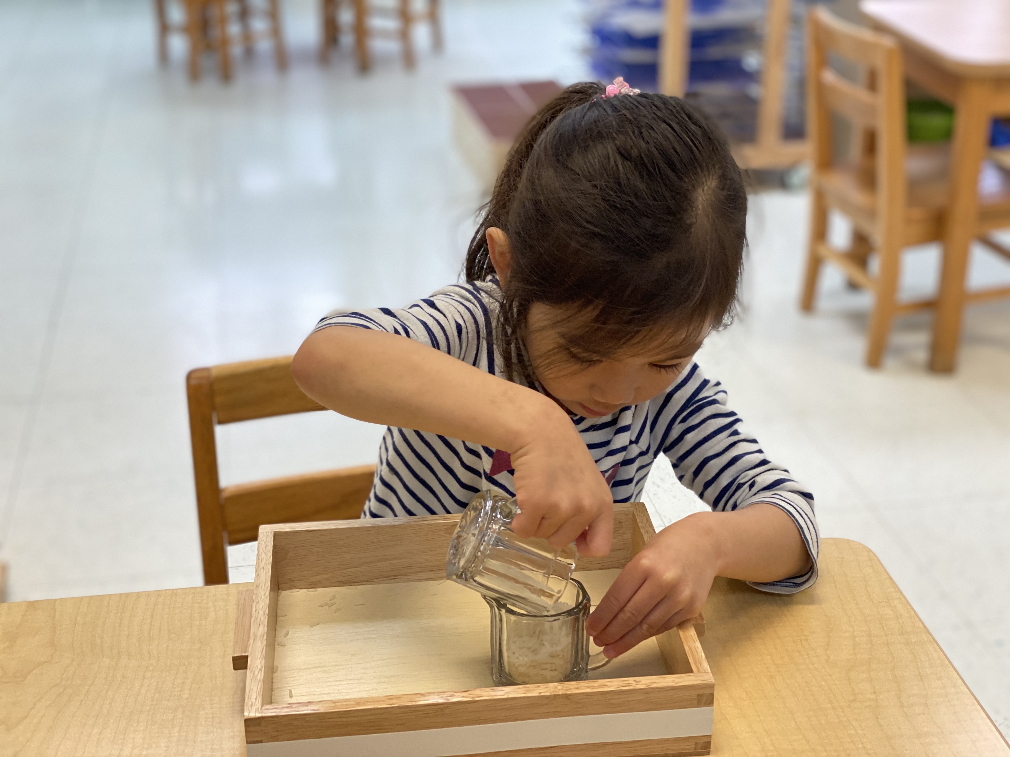 The child of an essential worker plays at a reopened Guidepost Montessori center. (Courtesy: Guidepost)