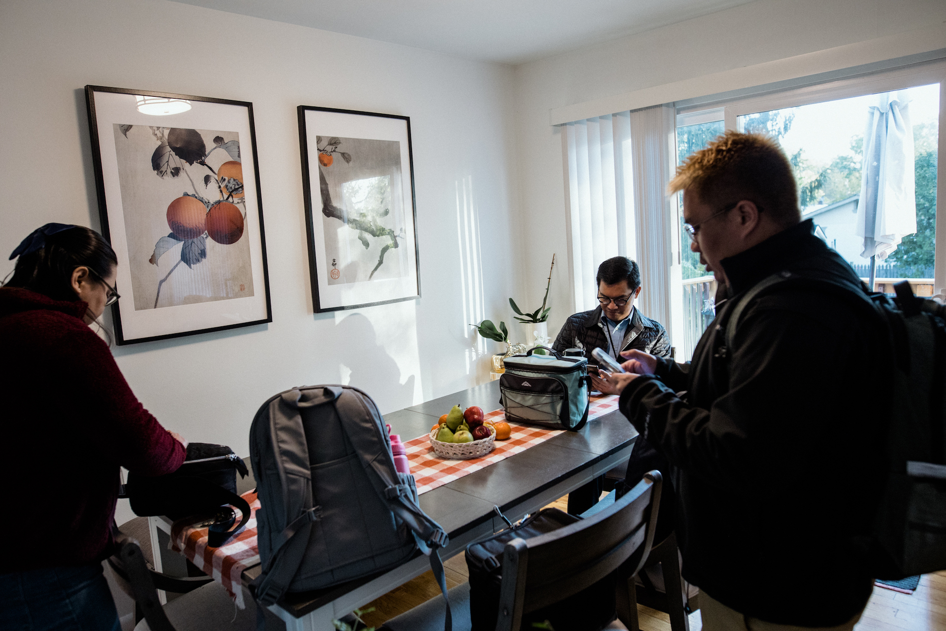 Evangelista, Sagun and Cruz get ready for work in their home in Beltsville, Maryland.
