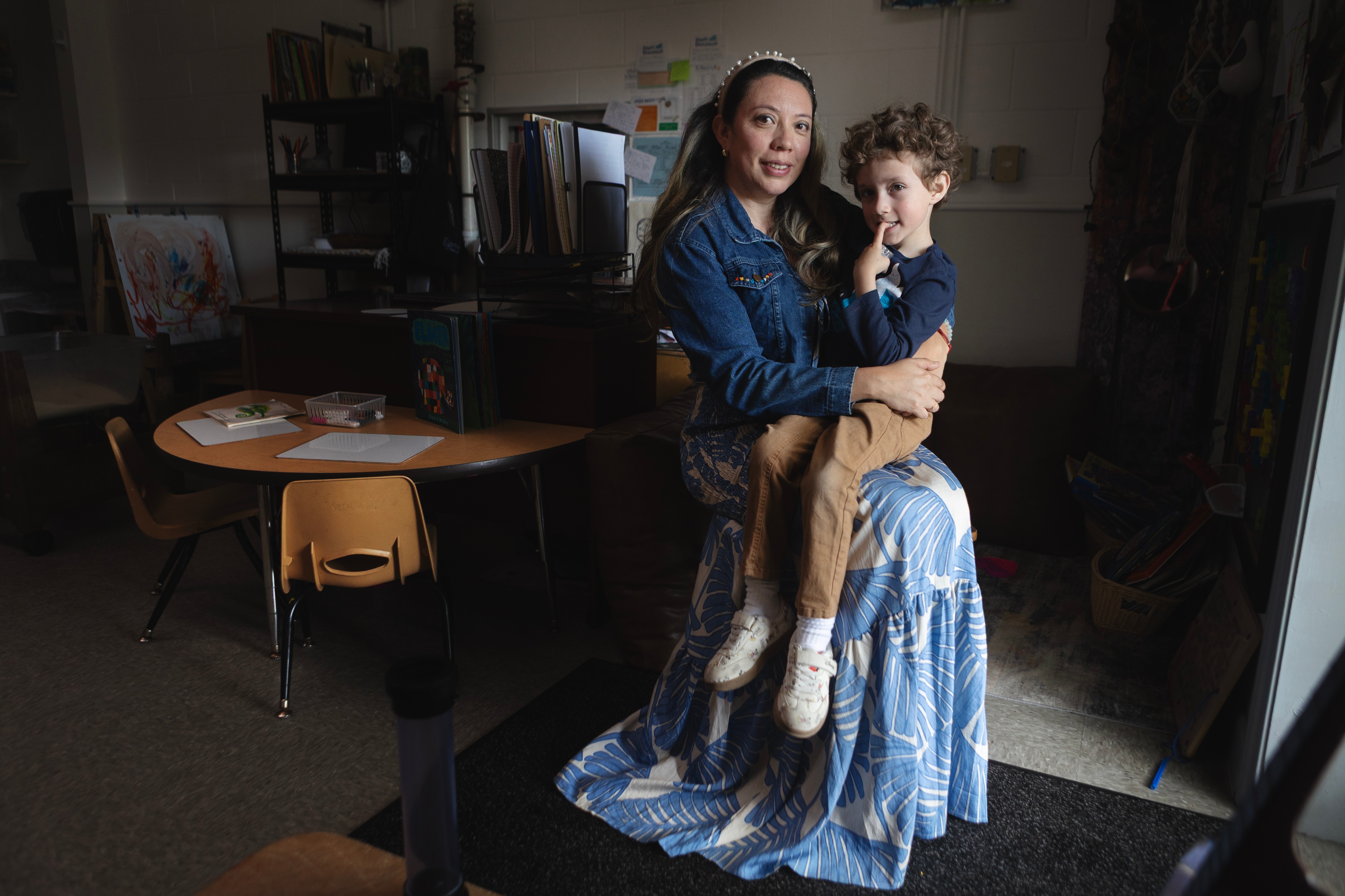 Diana McGuire poses for a portrait while holding her son, Noah McGuire, 4, on Wednesday, May 13, 2026, at St. Mary's Early Childhood Center in Indianapolis, Ind.