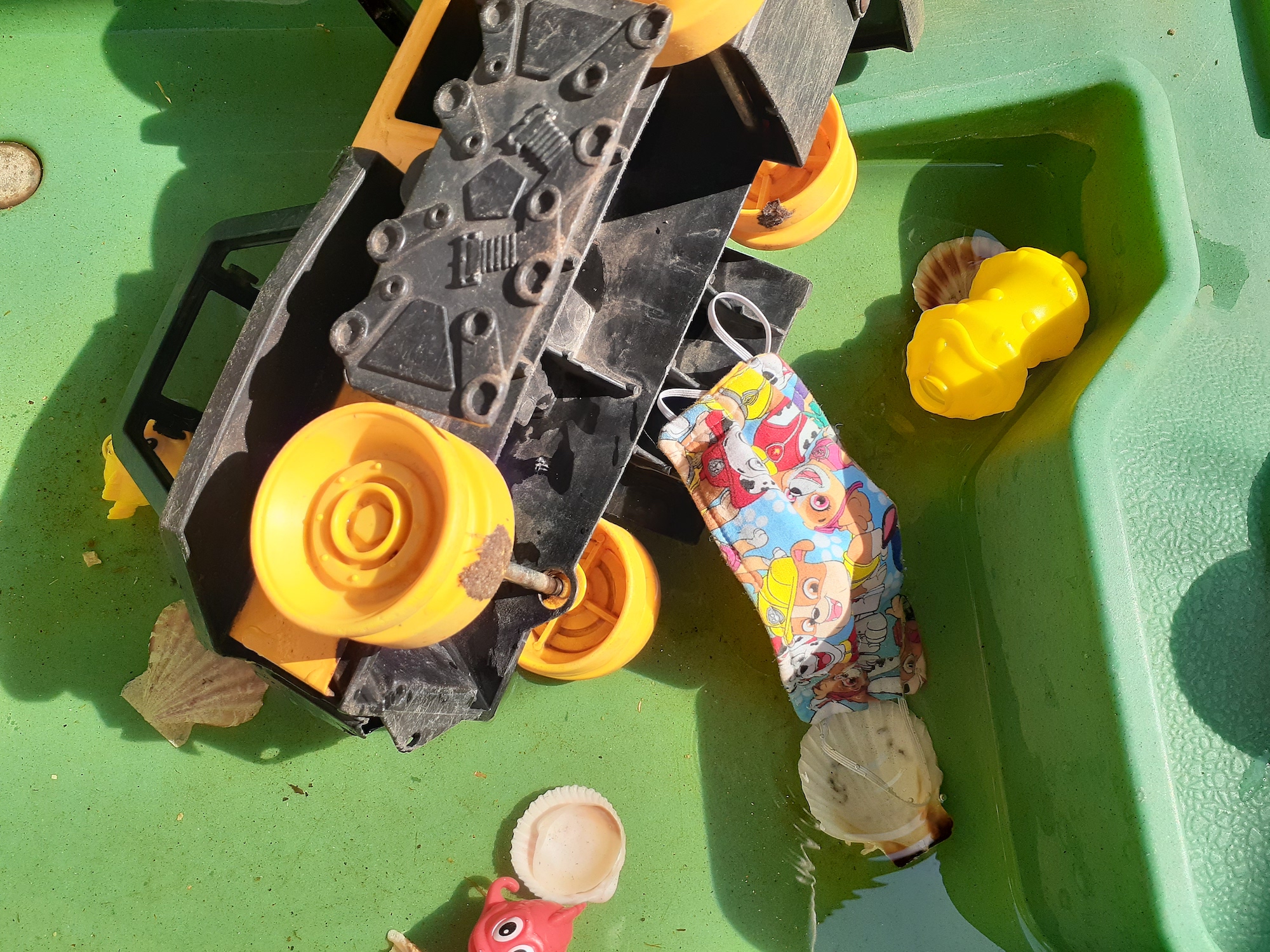 A child's mask with sand toys at Nuestra Casita Nursery. (Courtesy of Kathy Yanez)