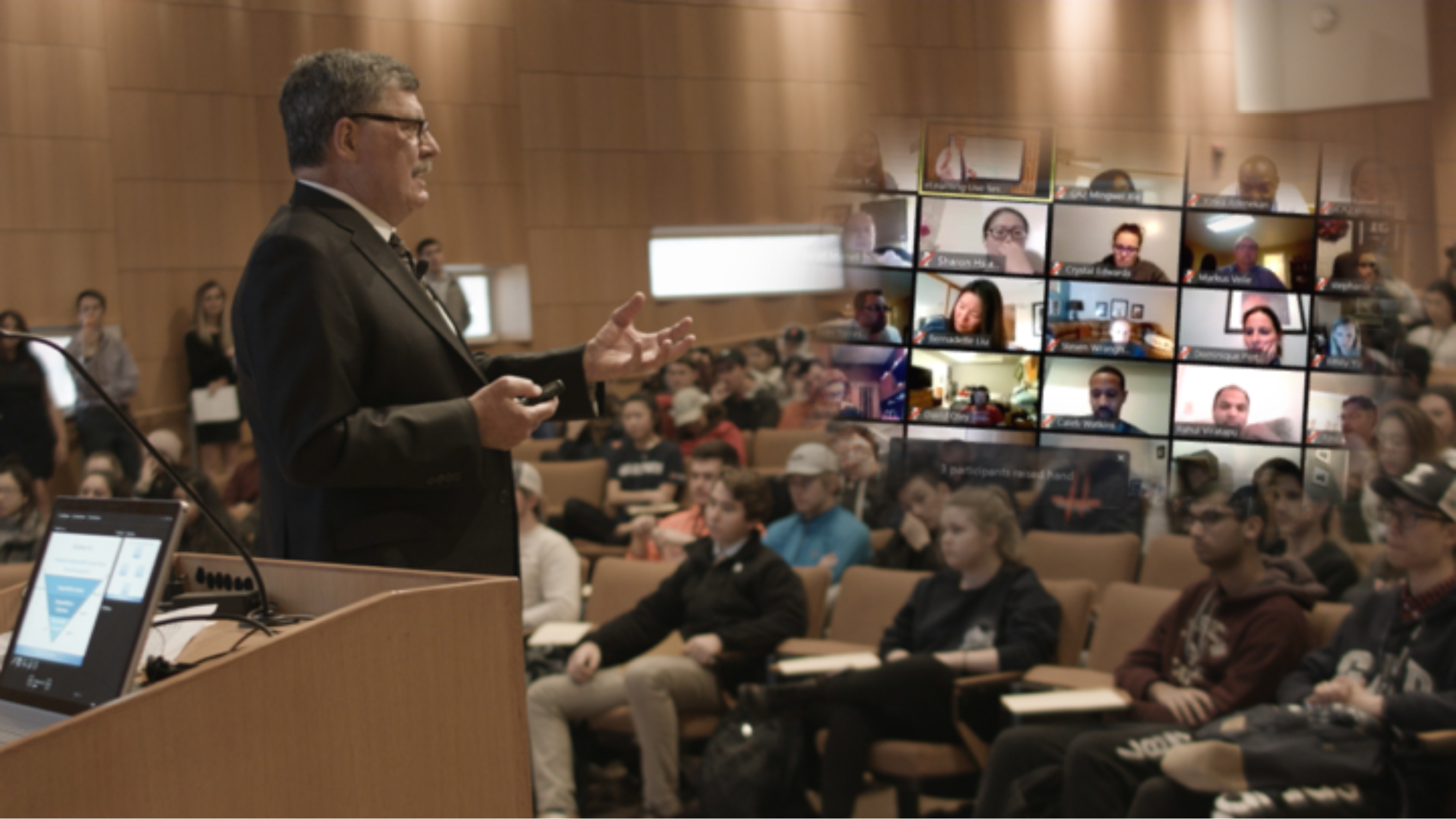 Lawrence DeBrock, a University of Illinois professor, leads live video classes for an online microeconomics courses.