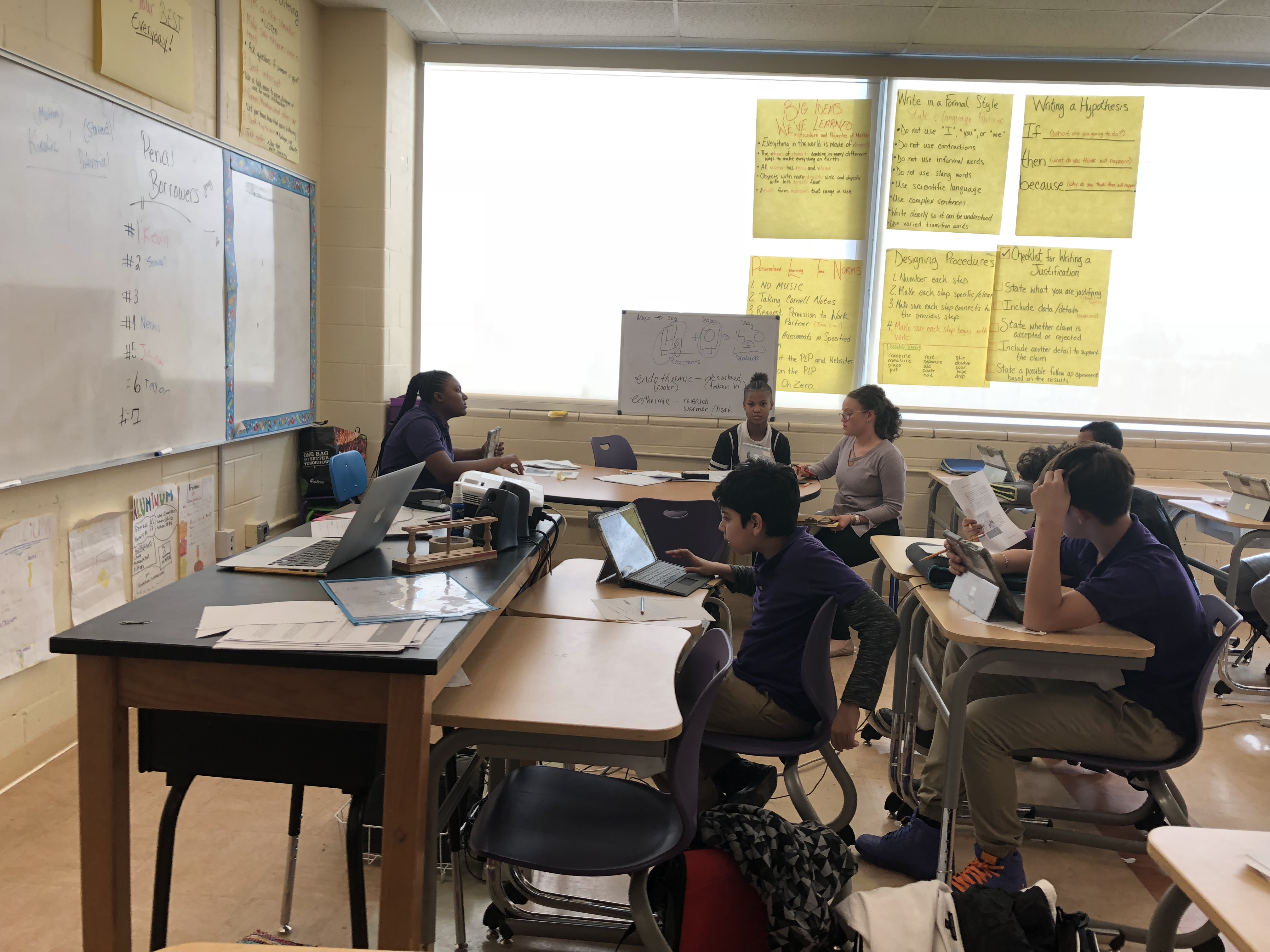 Teacher, Courtney Grant, offering feedback to students in her science classroom on the Summit Platform at Truesdell Education Campus Photo Credit: Jenny Abamu