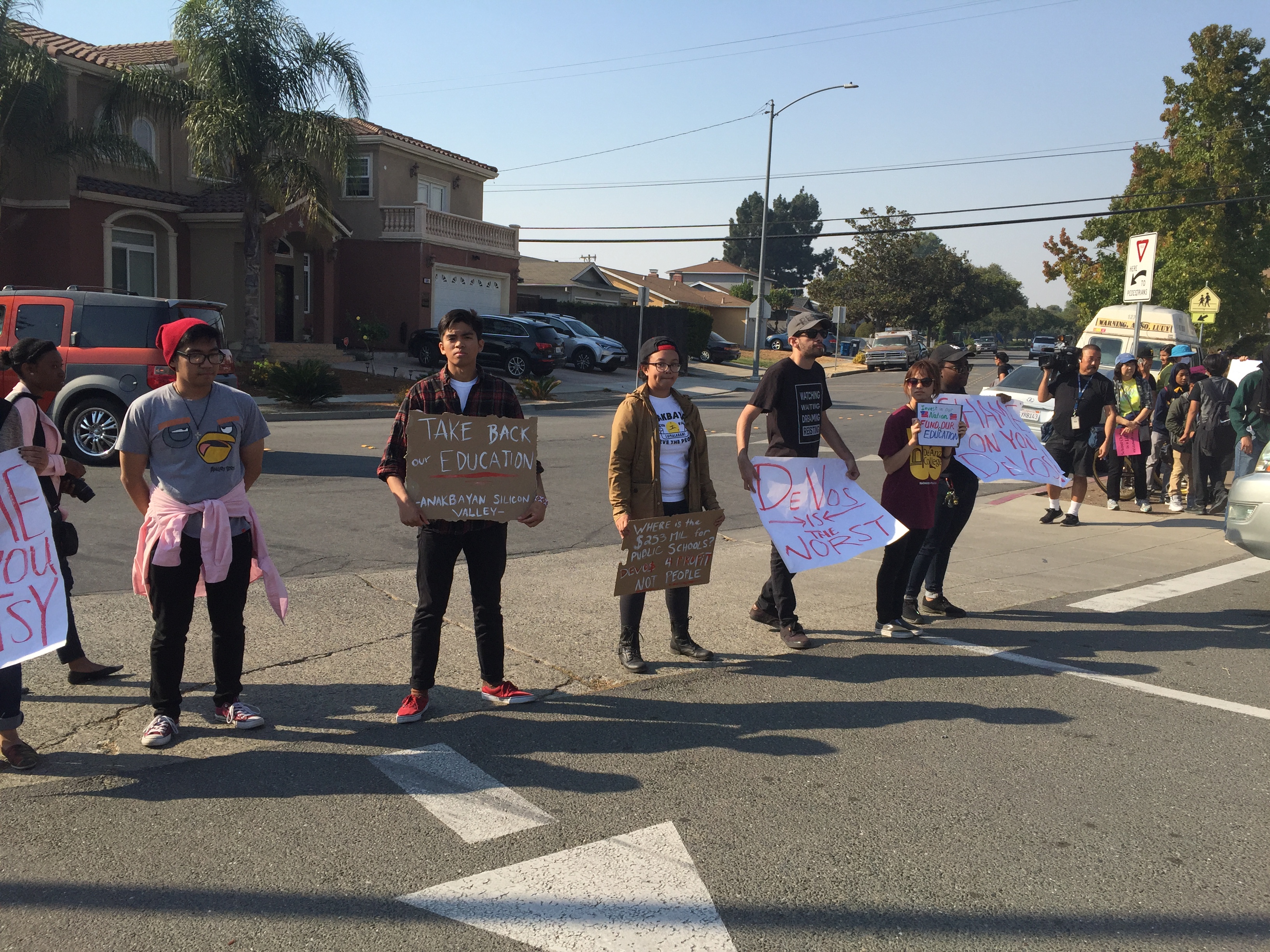 People protest Betsy DeVos. Photo Credit: Tina Nazerian
