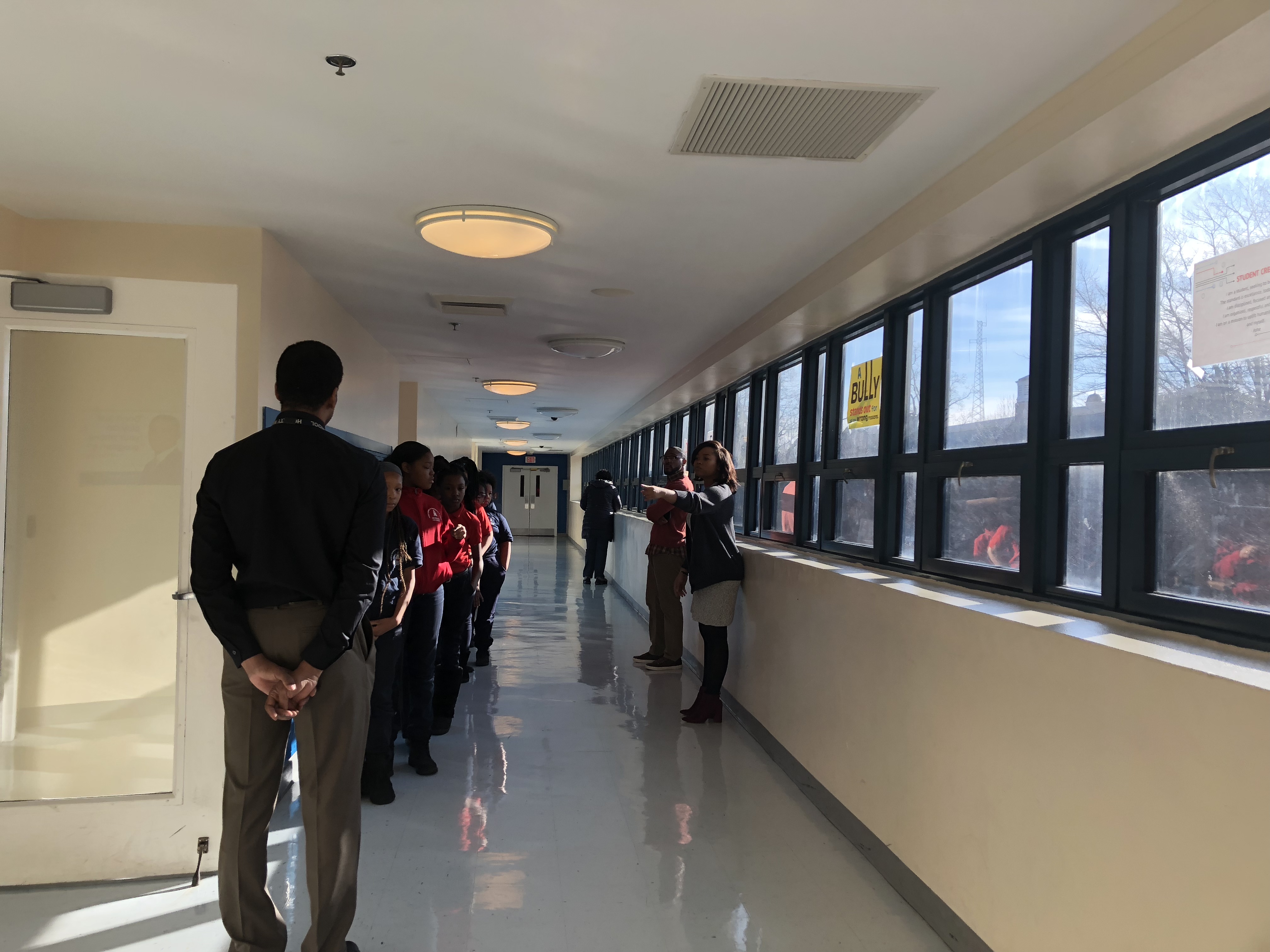 Teachers greeting students before they enter the classroom at Howard. Photo Credit: Jenny Abamu
