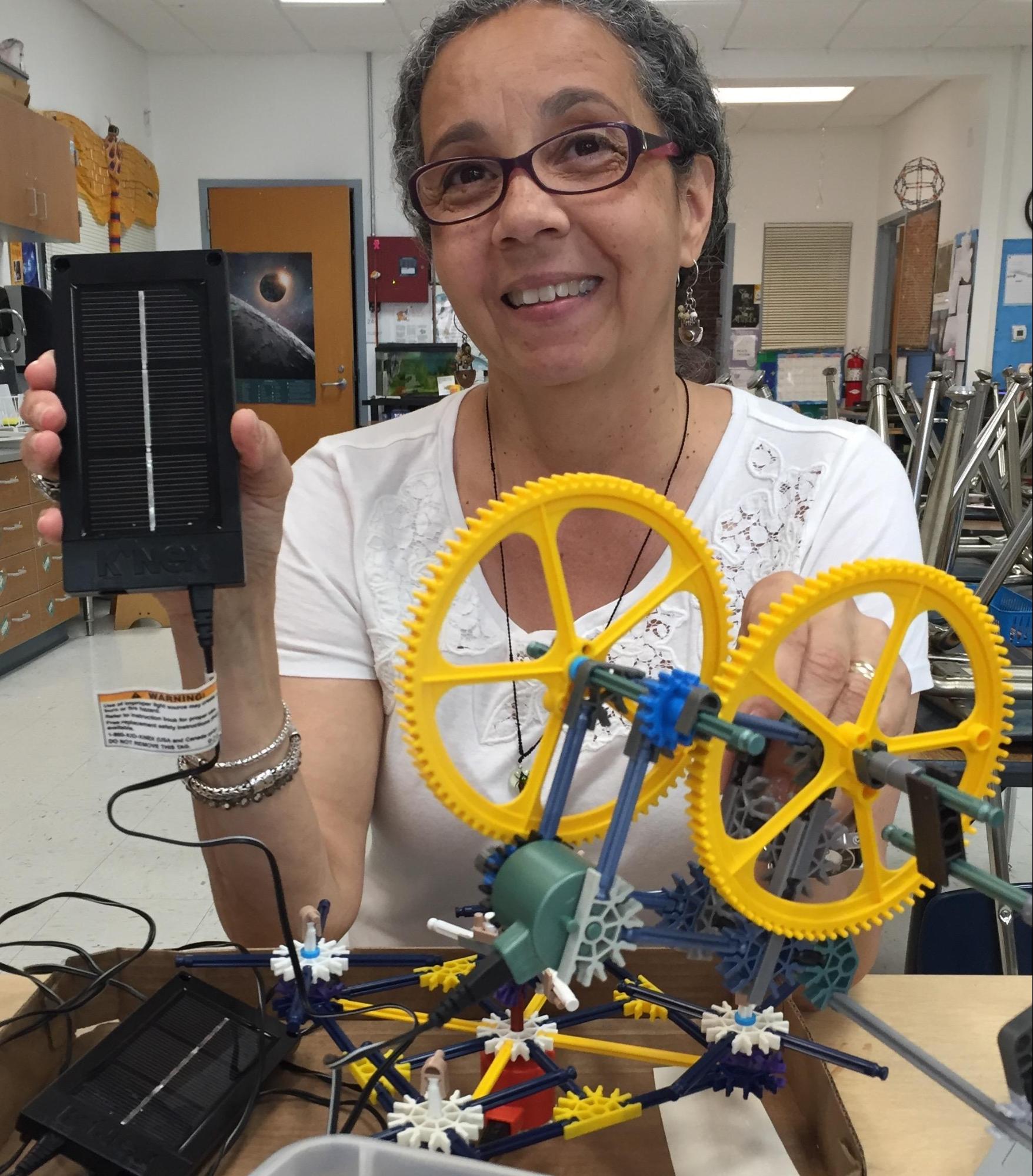 Treva Fitts, a TechTerra instructor, sharing K’Nex construction kit with solar panel control