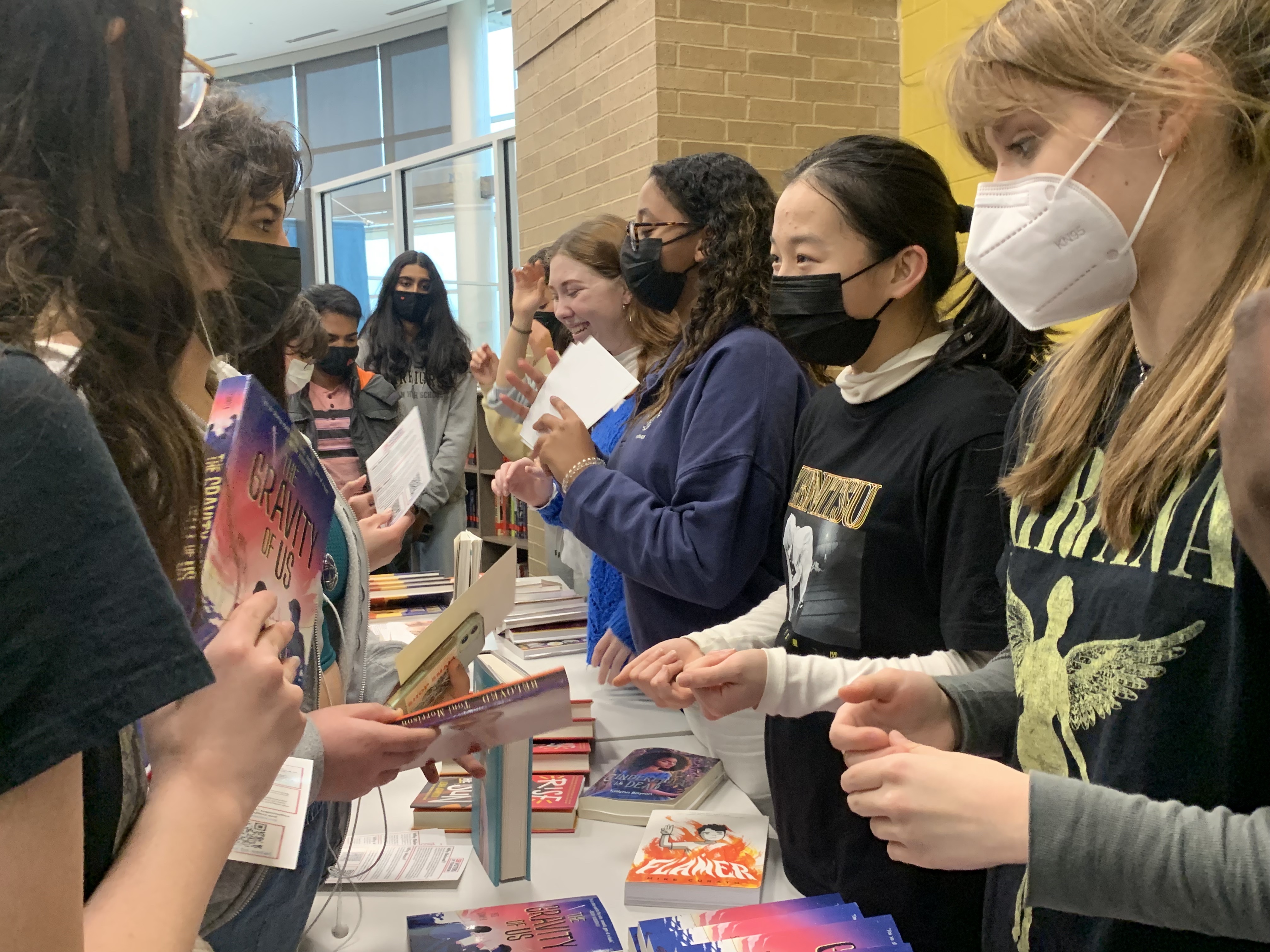 Students with Voters of Tomorrow distribute books at Jordan High School in Katy, Texas, in February 2022.
