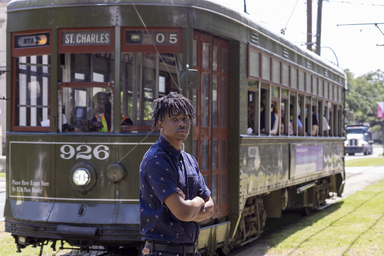 Vernell in front of a street car