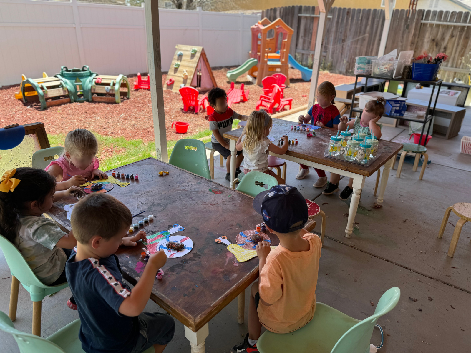 The roof on Tessie Ragan's home covers a portion of the backyard, offering kids in her program a shaded patio. But the sun-exposed area is often too hot for children. Photo courtesy of Ragan.