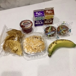 One of the meals provided by Leyden food service staff during school closures. The words, "Put on a happy face," are written on the banana in Sharpie. (Credit: Beth Kujawa)