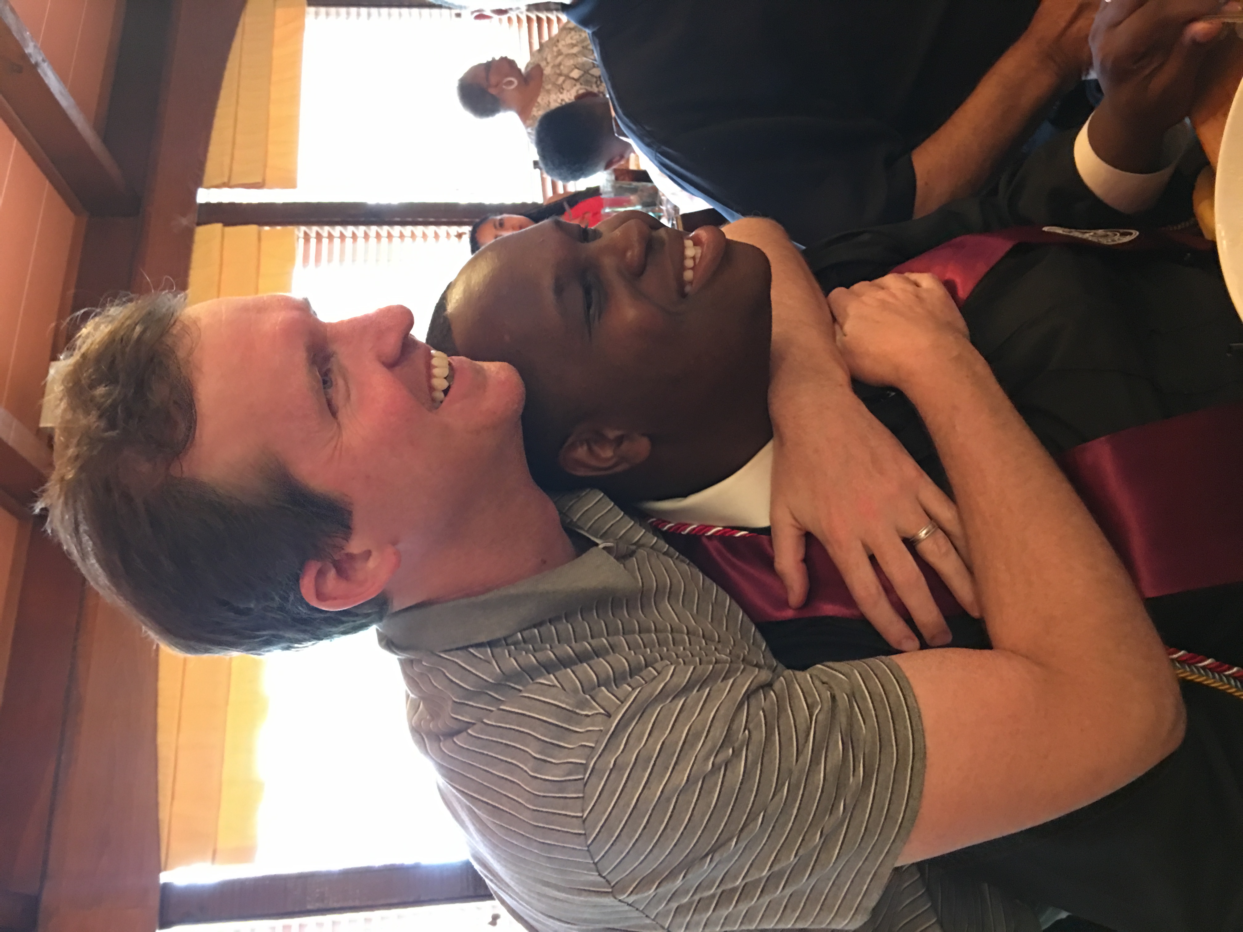 Bradley Dennison (left) and his "little brother" Timothy Witchet celebrate Witchet's graduation from Texas Southern University in May 2019. They were paired through Big Brothers Big Sisters when Witchet was in fifth grade.