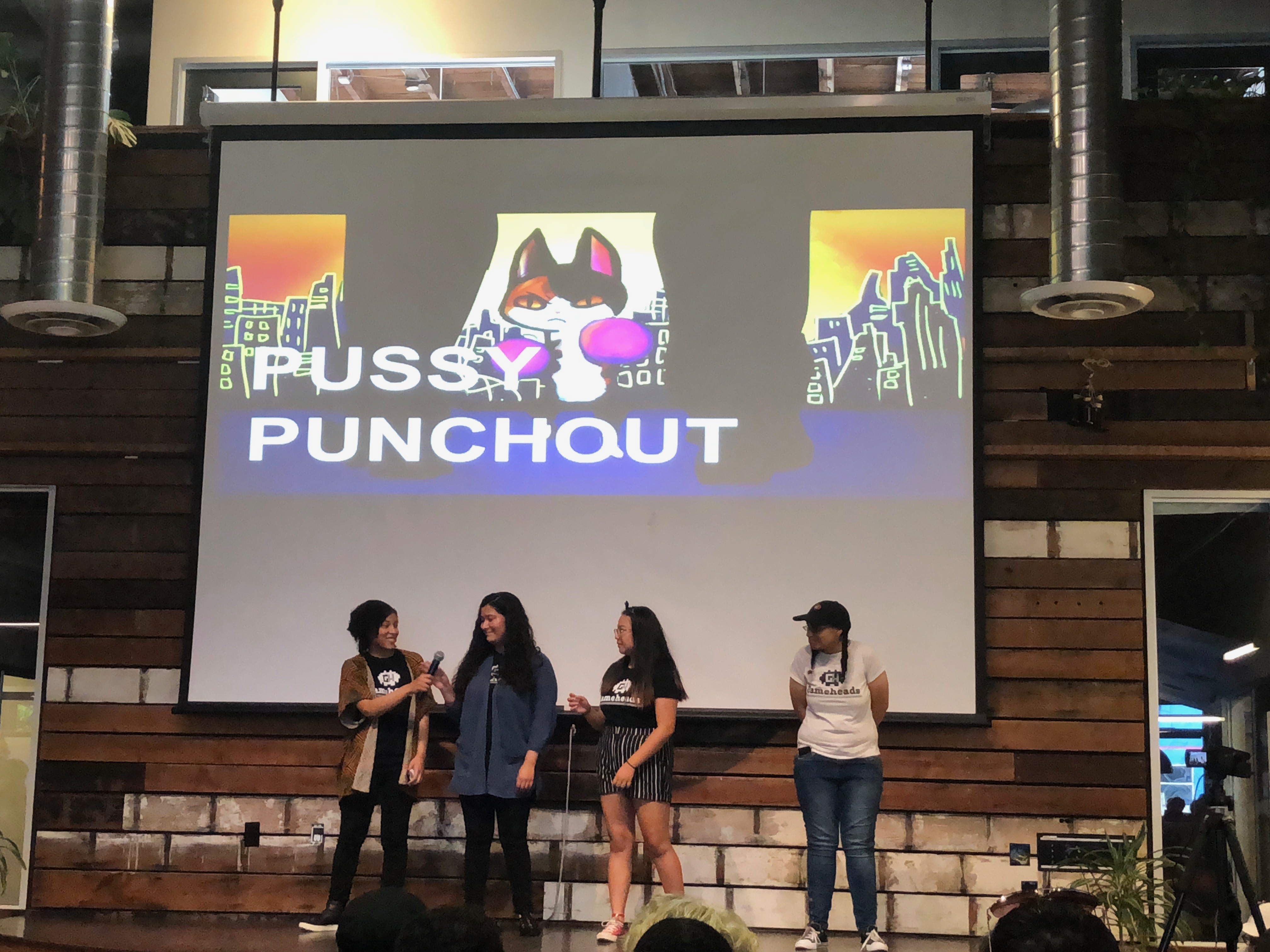 The all-female group who created Pussy Punchout describes the video game to the audience. Photo Credit: Tina Nazerian
