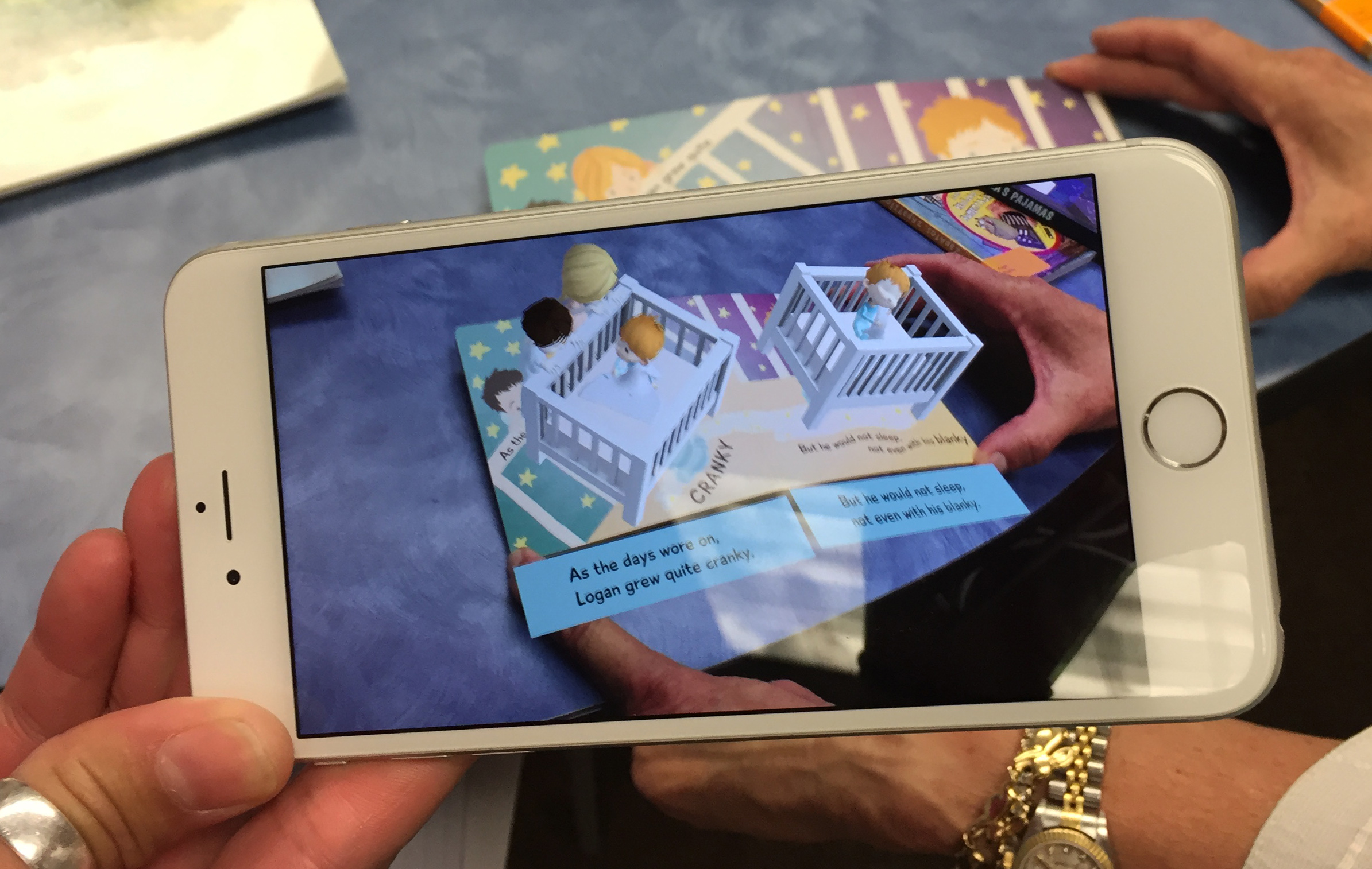 Colemere and Cannady demonstrate an AR book for infants.