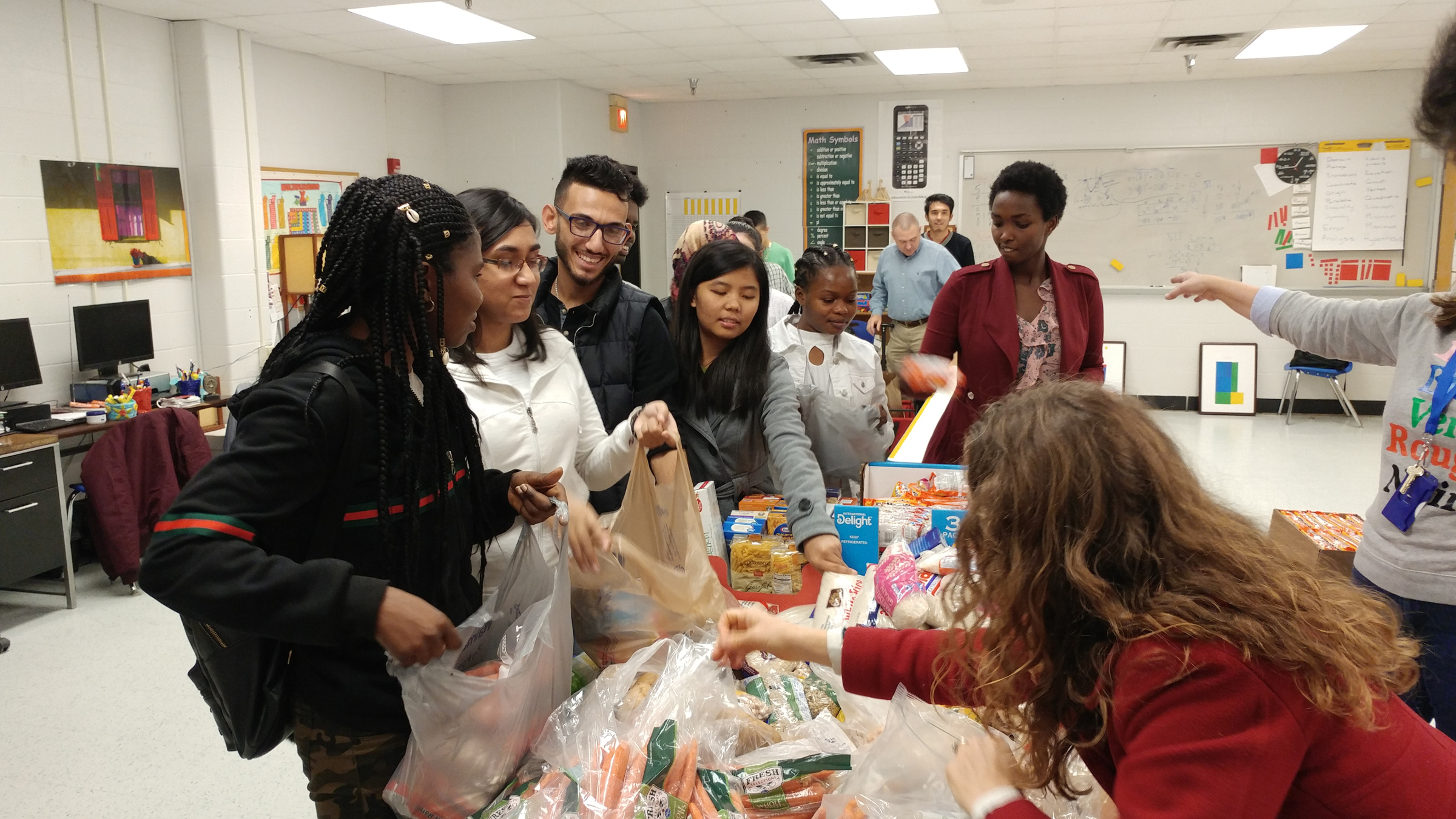 Muan (fourth from left) and peers organize and run a food drive for students in their district. (photo: A2G Team)