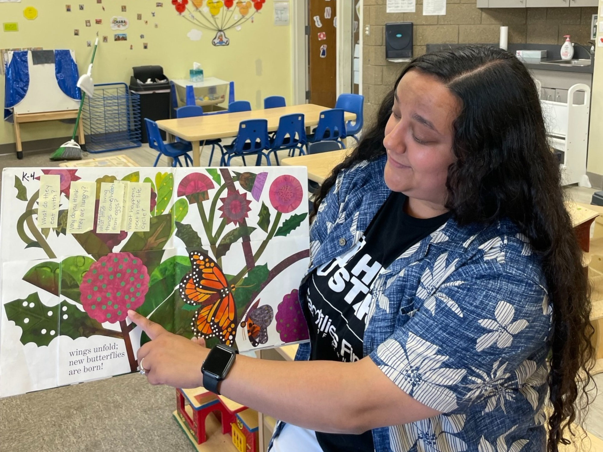 Katelyn Sarkar, a lead teacher and early childhood apprentice in Rochester, Minnesota, reads a book in her Head Start classroom. Photo courtesy of Sarkar.