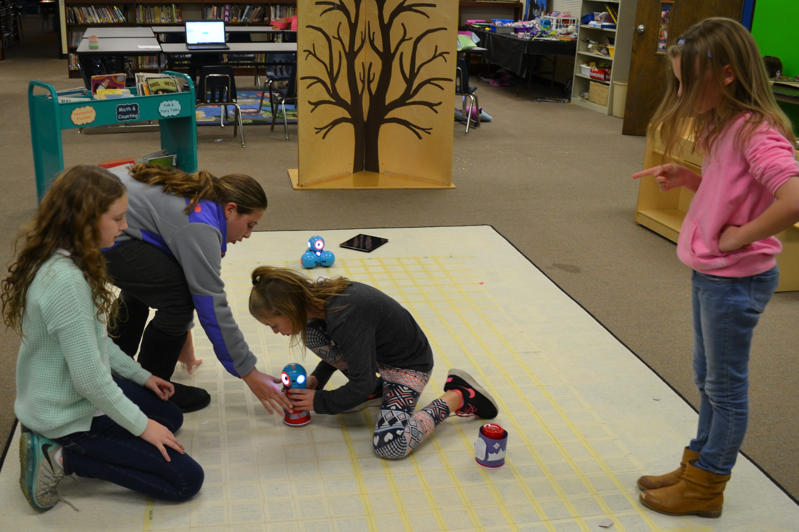 Female students working with robots