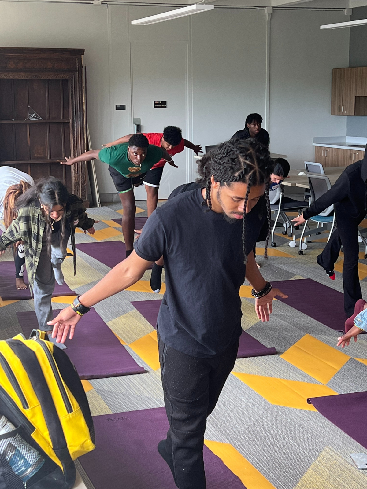 Genius, Joy and Love students participate in a yoga and mindfulness session led by Pitt School of Education faculty members. (Credit: University of Pittsburgh School of Education)