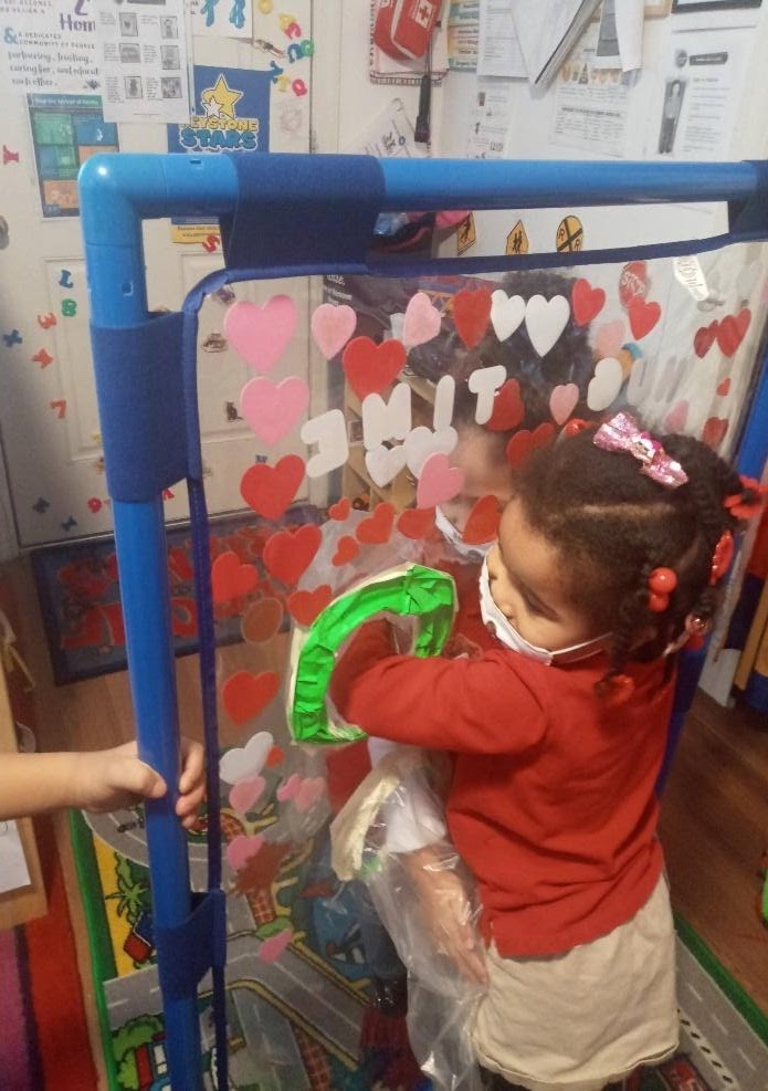 A child uses the hug screen at Lil’ Bits Family Child Care Home. (Courtesy of Adrienne Briggs)