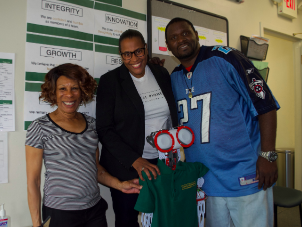 DPA Principal Mashea Ashton (center) with two founding staff members of the school and Meccanoid, the talking robot and secret weapon during recruiting. (Emily Tate / EdSurge)