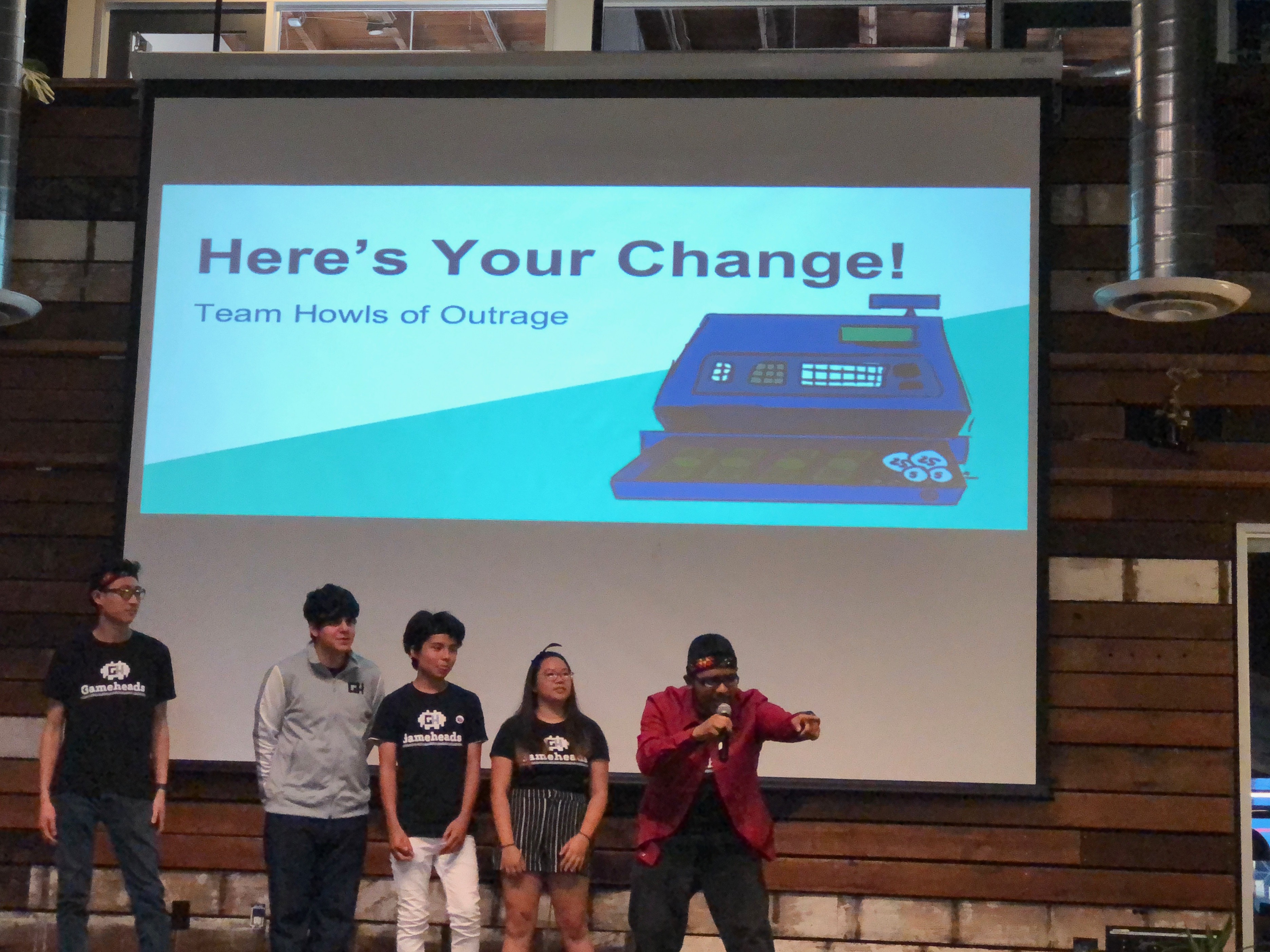 The group that made Here's Your Change! presents on stage. Photo Credit: Tina Nazerian