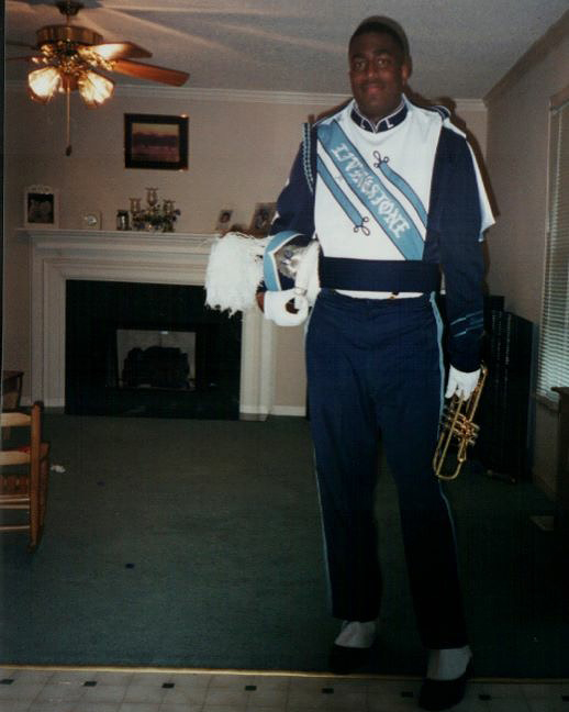 28-year-old Anthony Johnson posing for a photo in his Livingstone College marching band uniform. Photo credit: Anthony Johnson.
