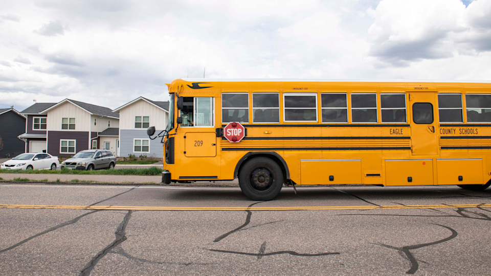 An Eagle County school bus passes affordable houses sold to district staff. Photo by Kelsey Brunner for EdSurge.