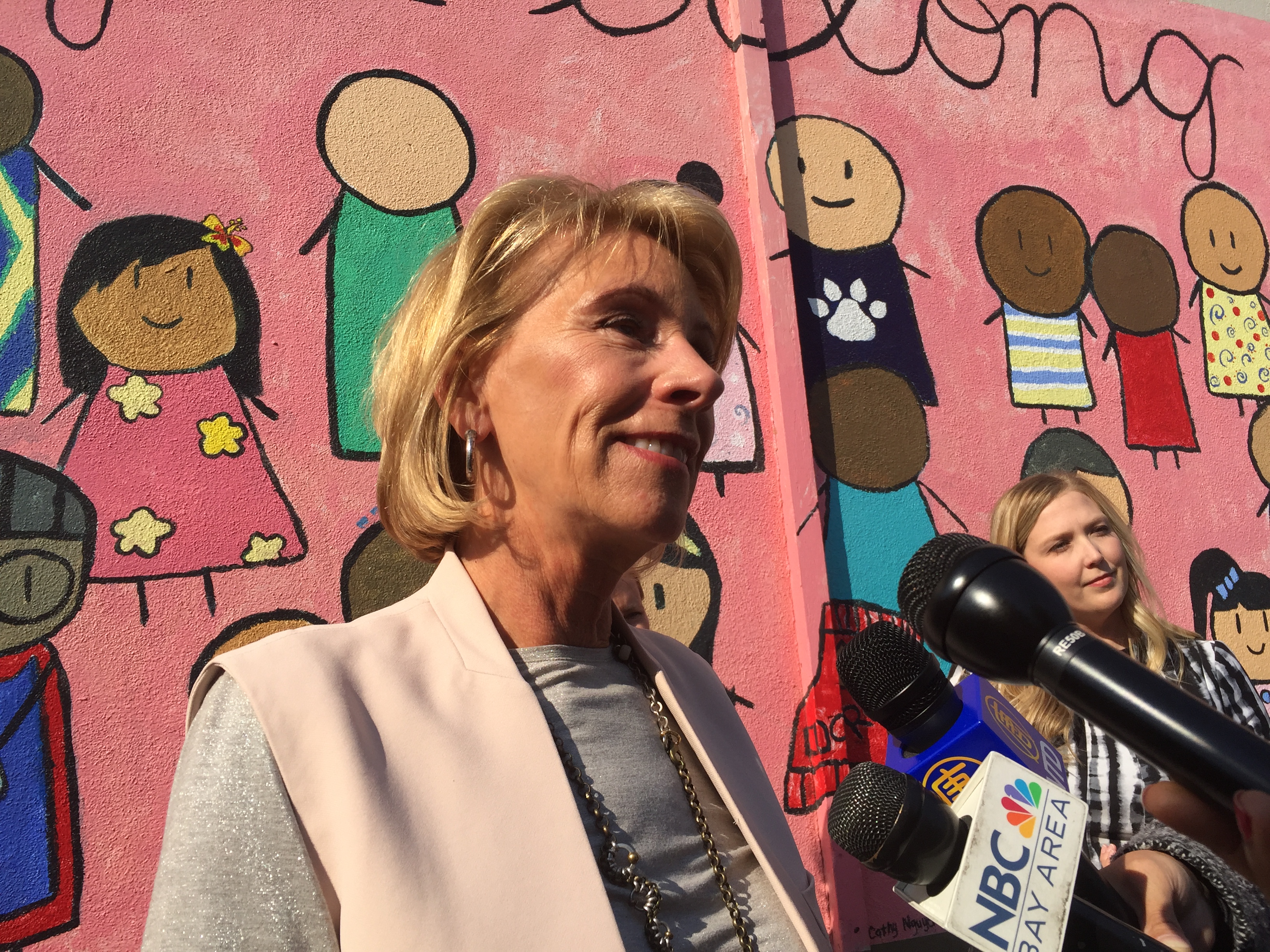 Betsy DeVos talks to reporters at Thomas Russell Middle School. Photo Credit: Tina Nazerian