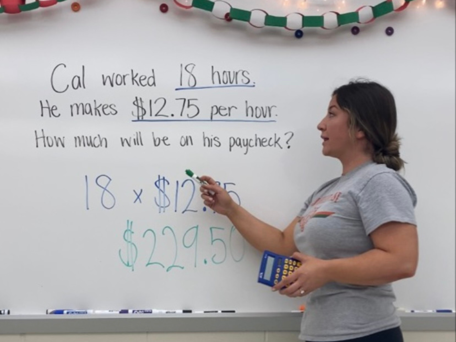 Reaghan Murphy guides students through a math problem. (Photo courtesy of Murphy)