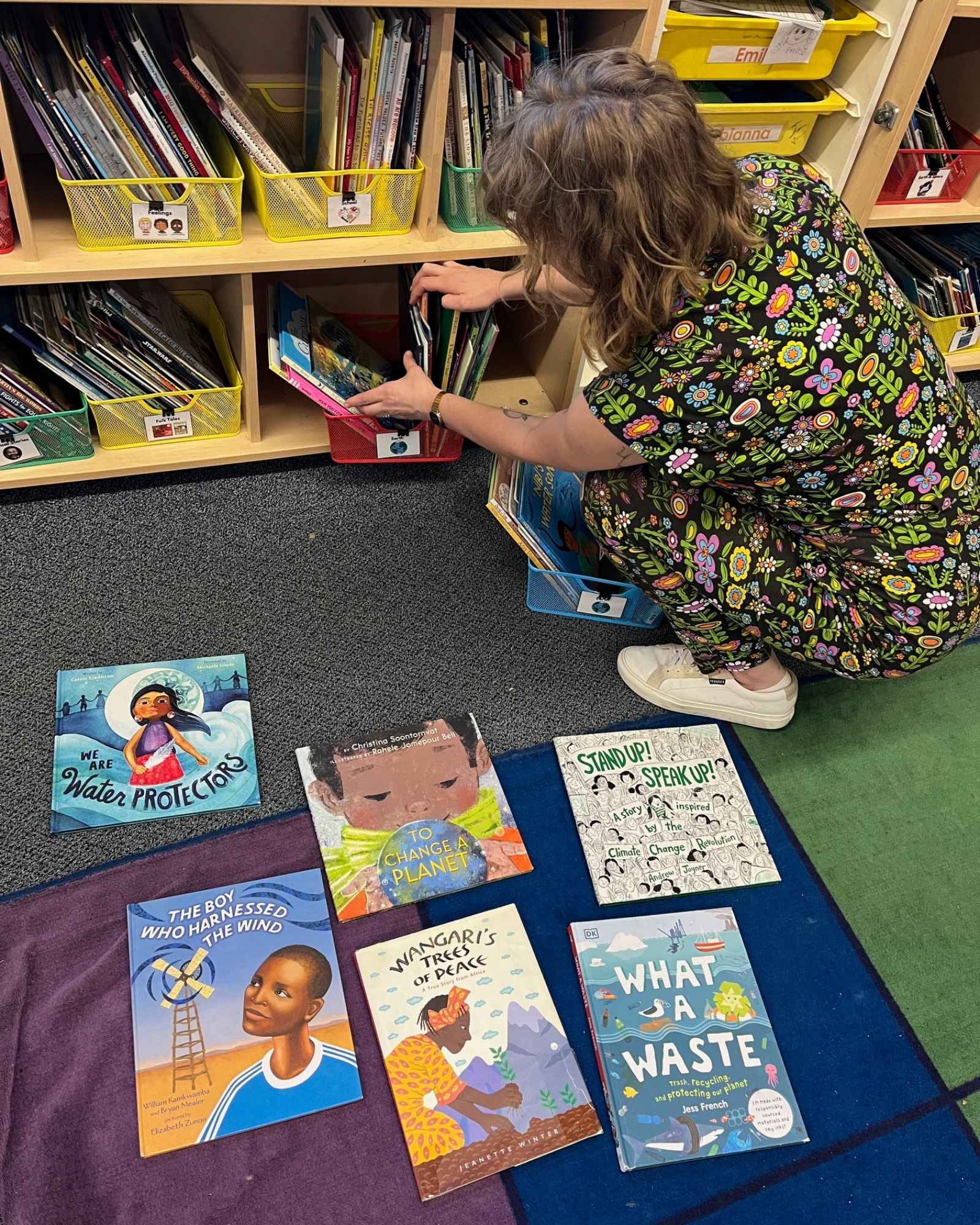 Heidi Rose has two full bins of books about conservation and the planet in her first grade classroom. Photo by Emily Tate Sullivan.