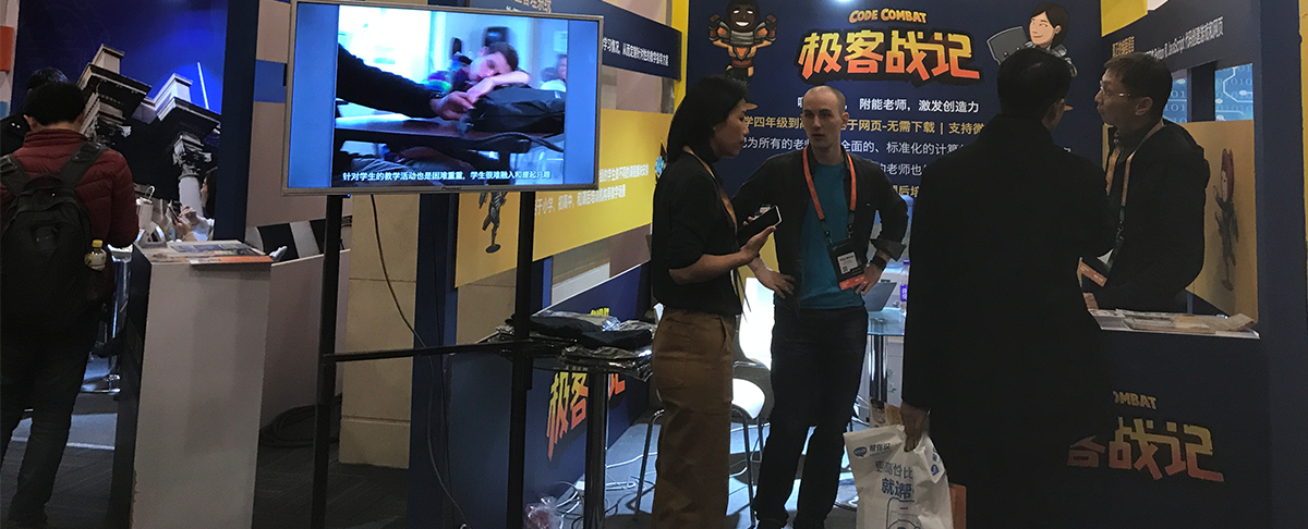 Nick Winter, founder and CEO of CodeCombat (center), hoped to raise awareness of his game-based service to teach computer coding.