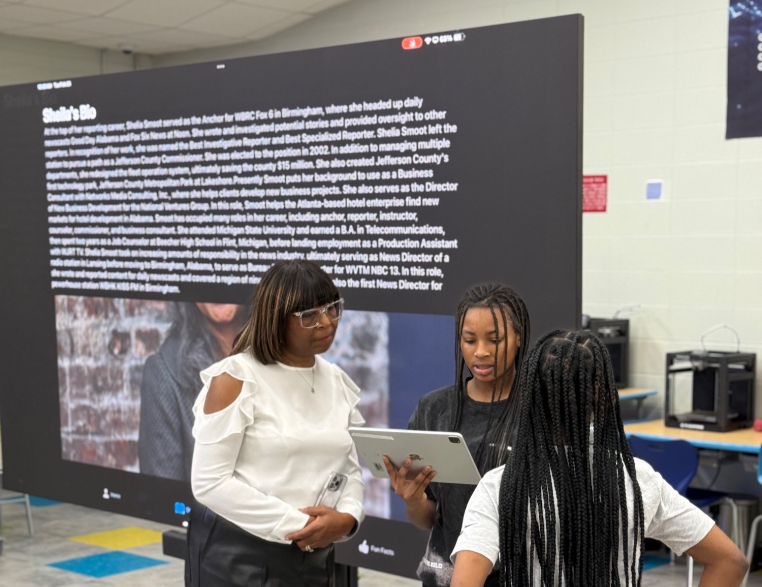 Students showcasing their apps to local community members.
