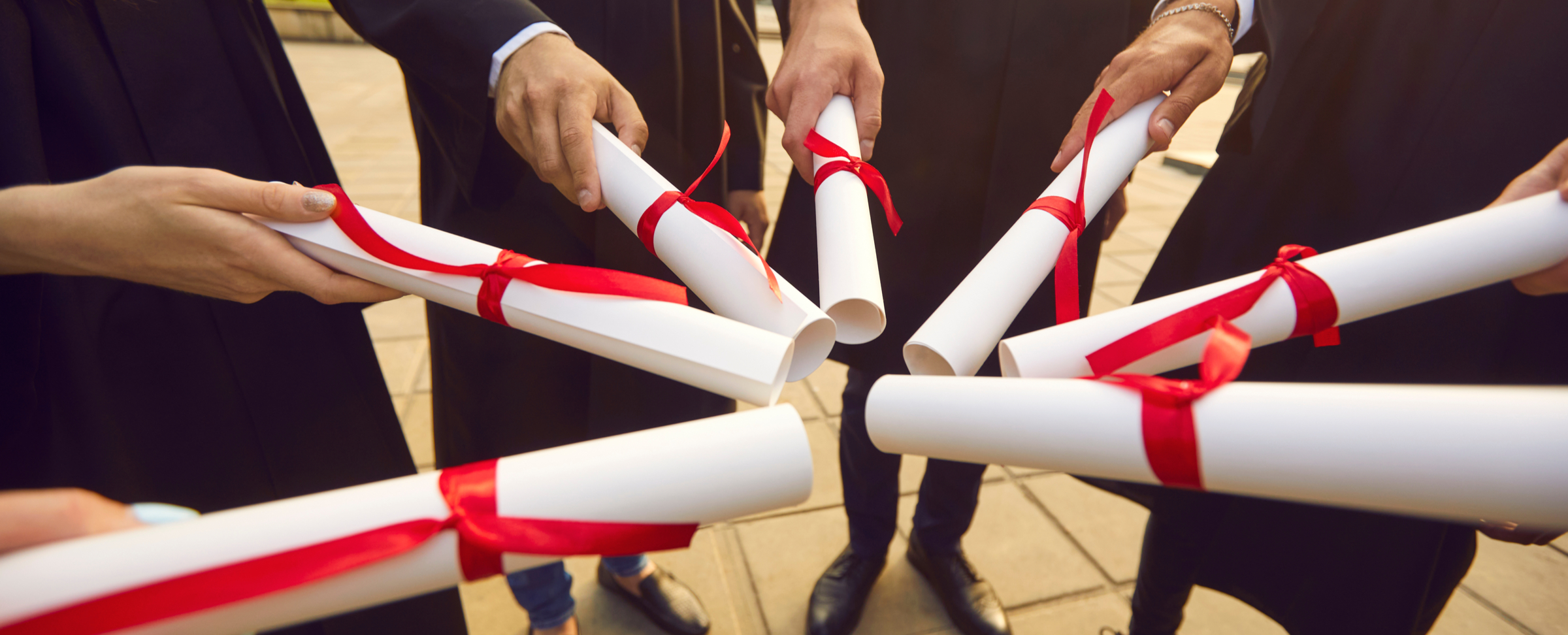 students_showing_off_diplomas-1631045240.jpg