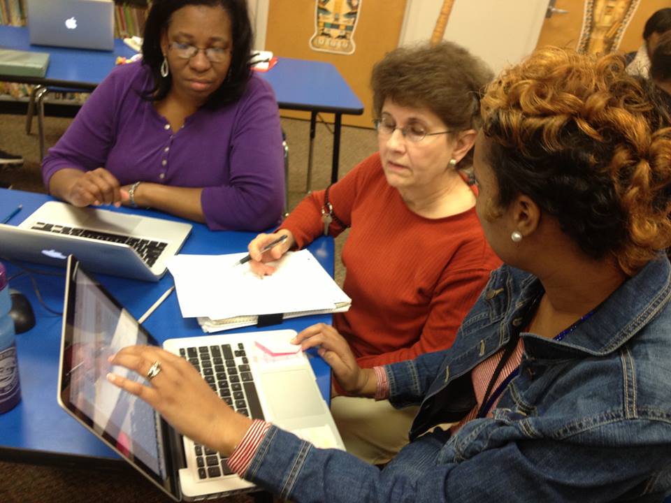 Teachers collaborating on lesson plans at HPSD.