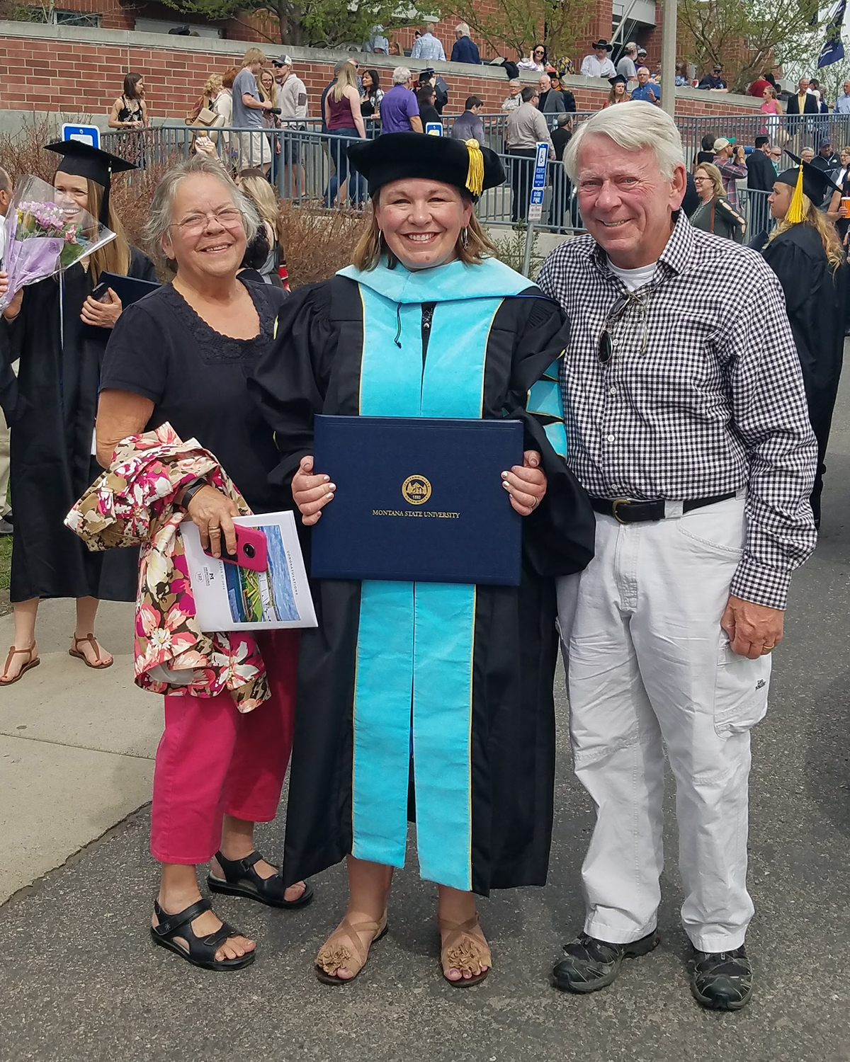Morrison and her parents Pat and Sandy Koerner after her hooding ceremony at Montana State University in 2018. Courtesy of Cali Morrison.