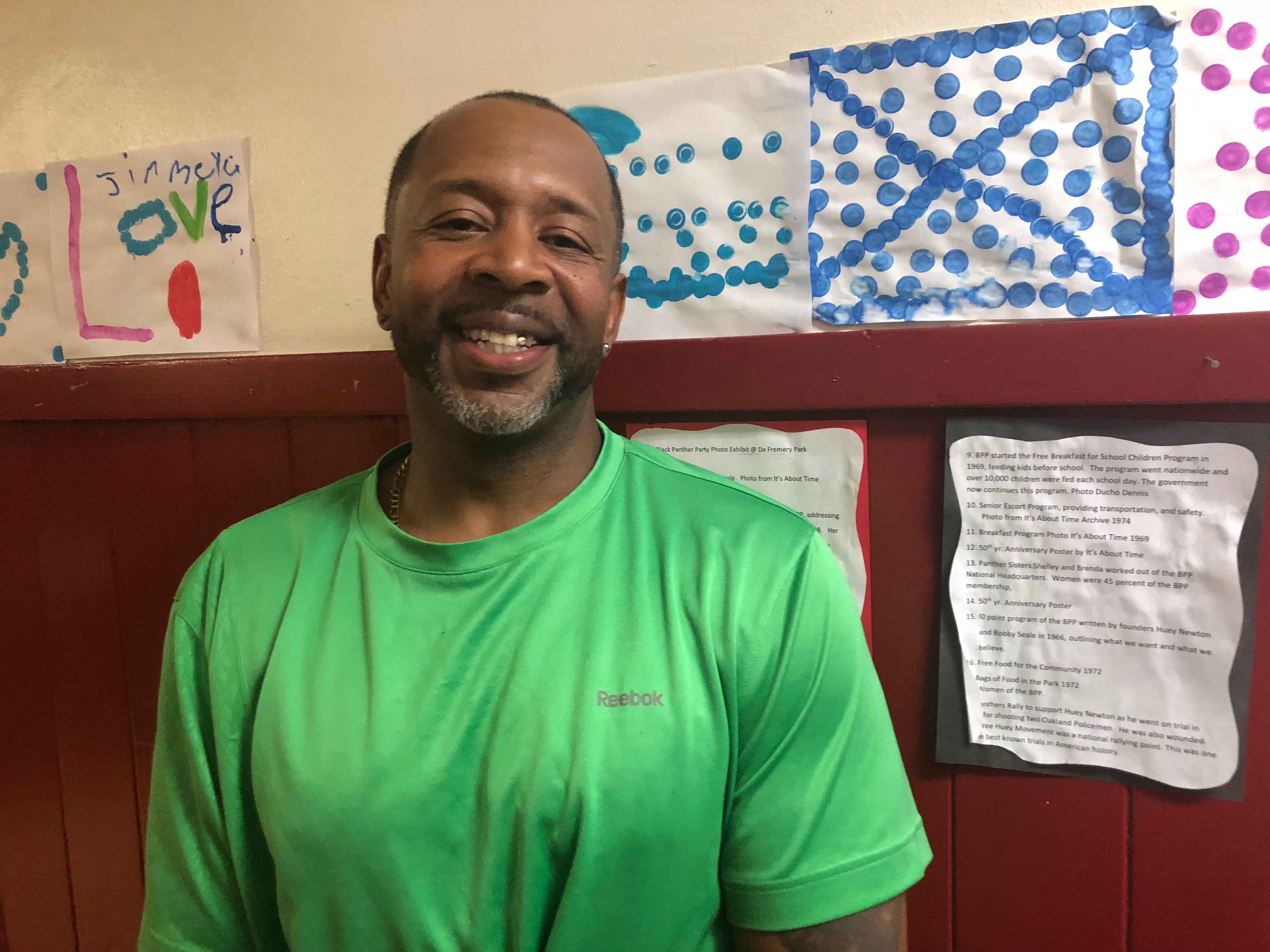 Mosi Zuberi stands in the hallway of the DeFremery Recreation Center after an Oakland REACH meeting. Photo Credit: Jenny Abamu