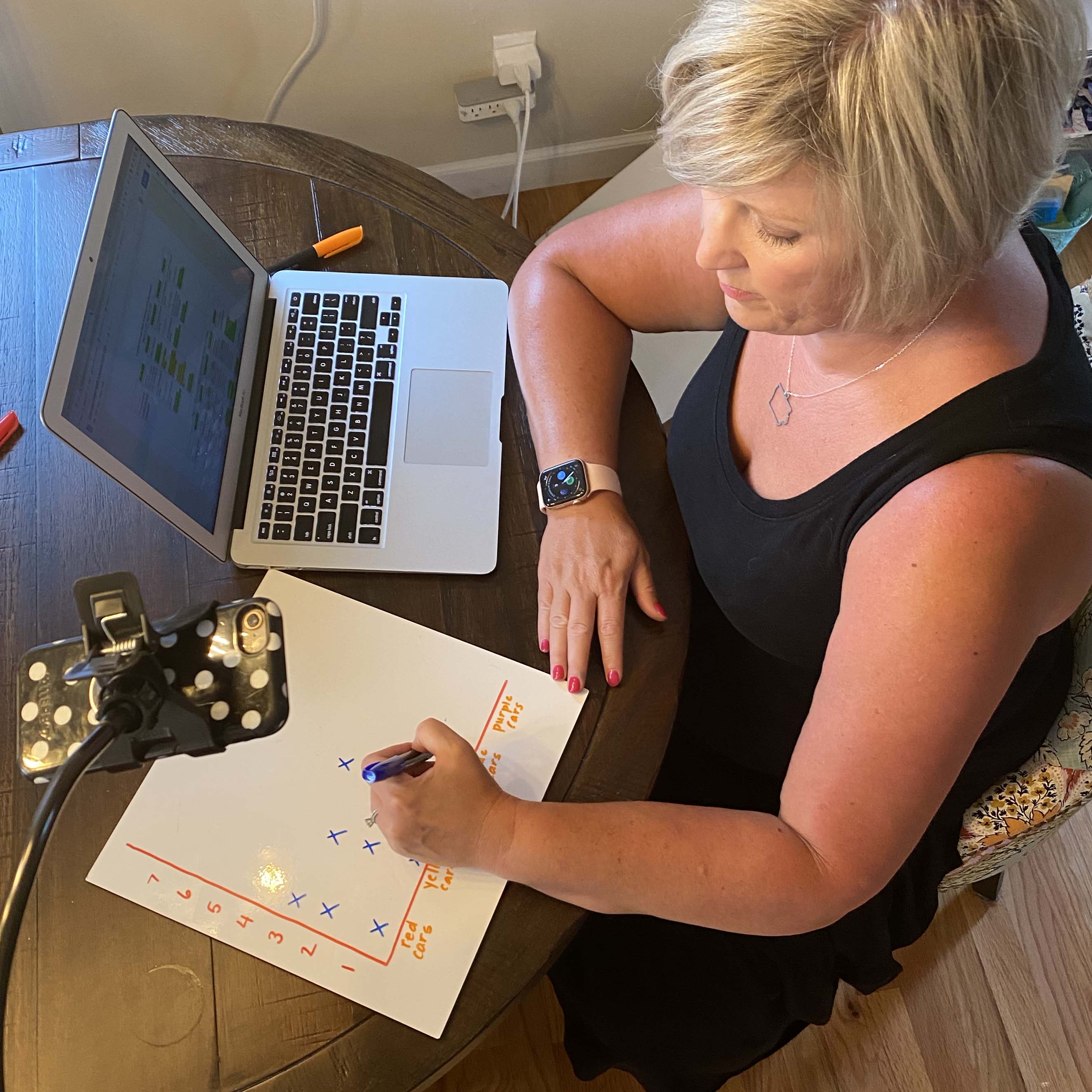Smith sketches a graph on an mcSquares Surface during a remote lesson with her students.
