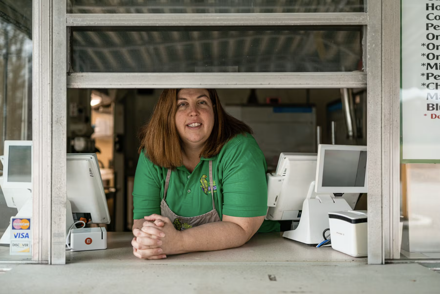 Cara Rothrock, a third grade teacher, works a second job at Polly’s Freeze. Photo by Jon Cherry for EdSurge.