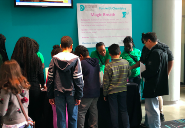 Students at the Magic Breath chemistry station. Photo Credit: Martha Karmali