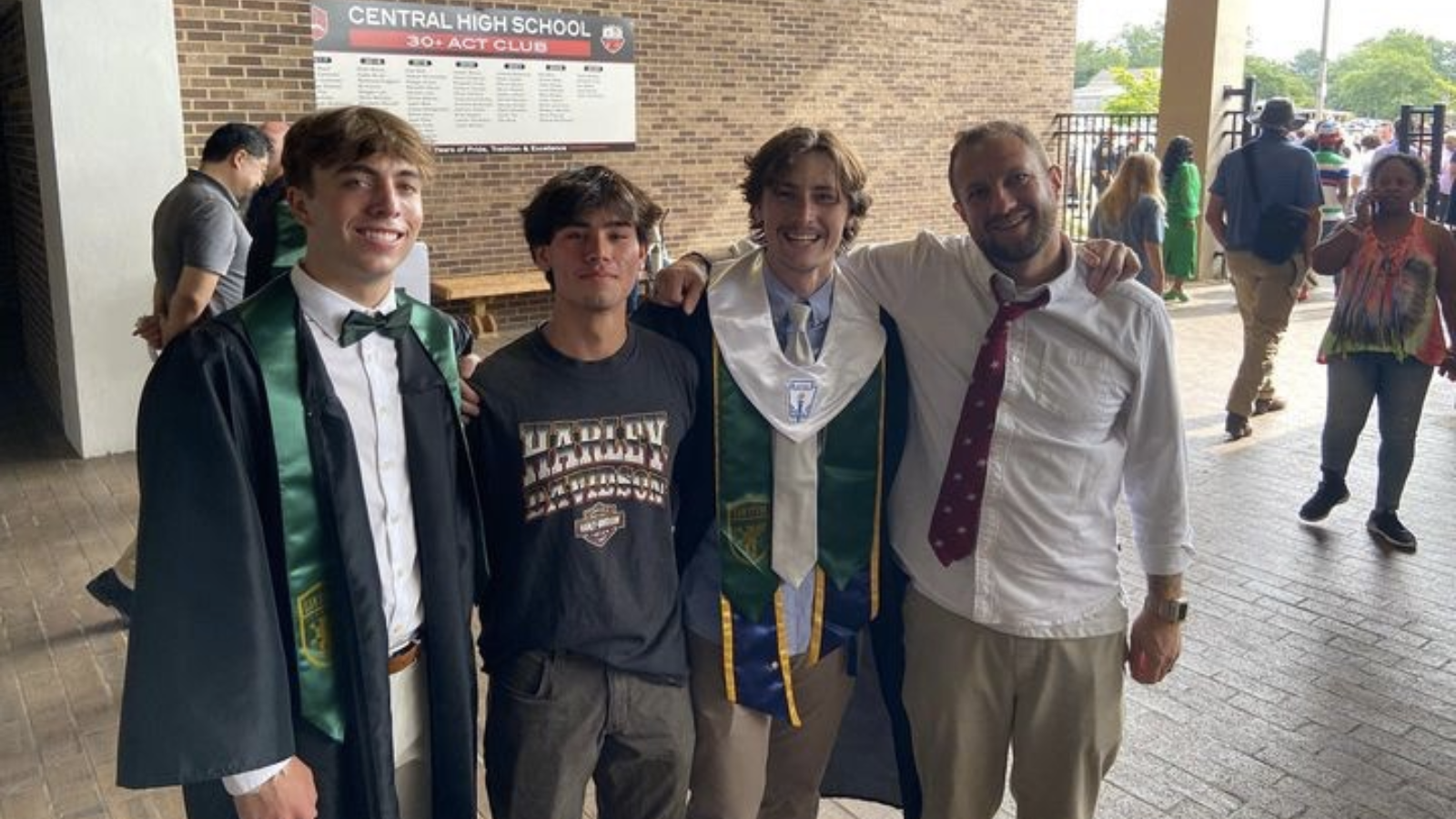 Josh Davenport, right, with students at their high school graduation. Photo courtesy of Davenport.