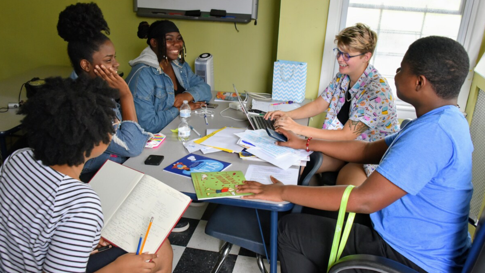 Riley Campbell, center left, during the writing process of “Man Up!” with her co-authors, illustrator and a story coach from publisher Shout Mouse Press. Photo courtesy of Campbell.