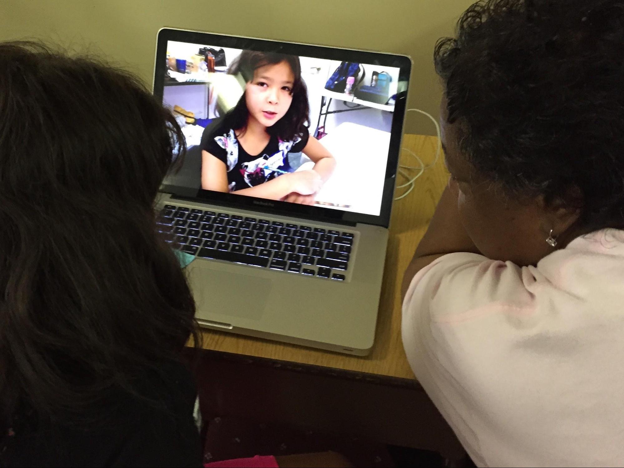 Student editing her digital story with iMovie