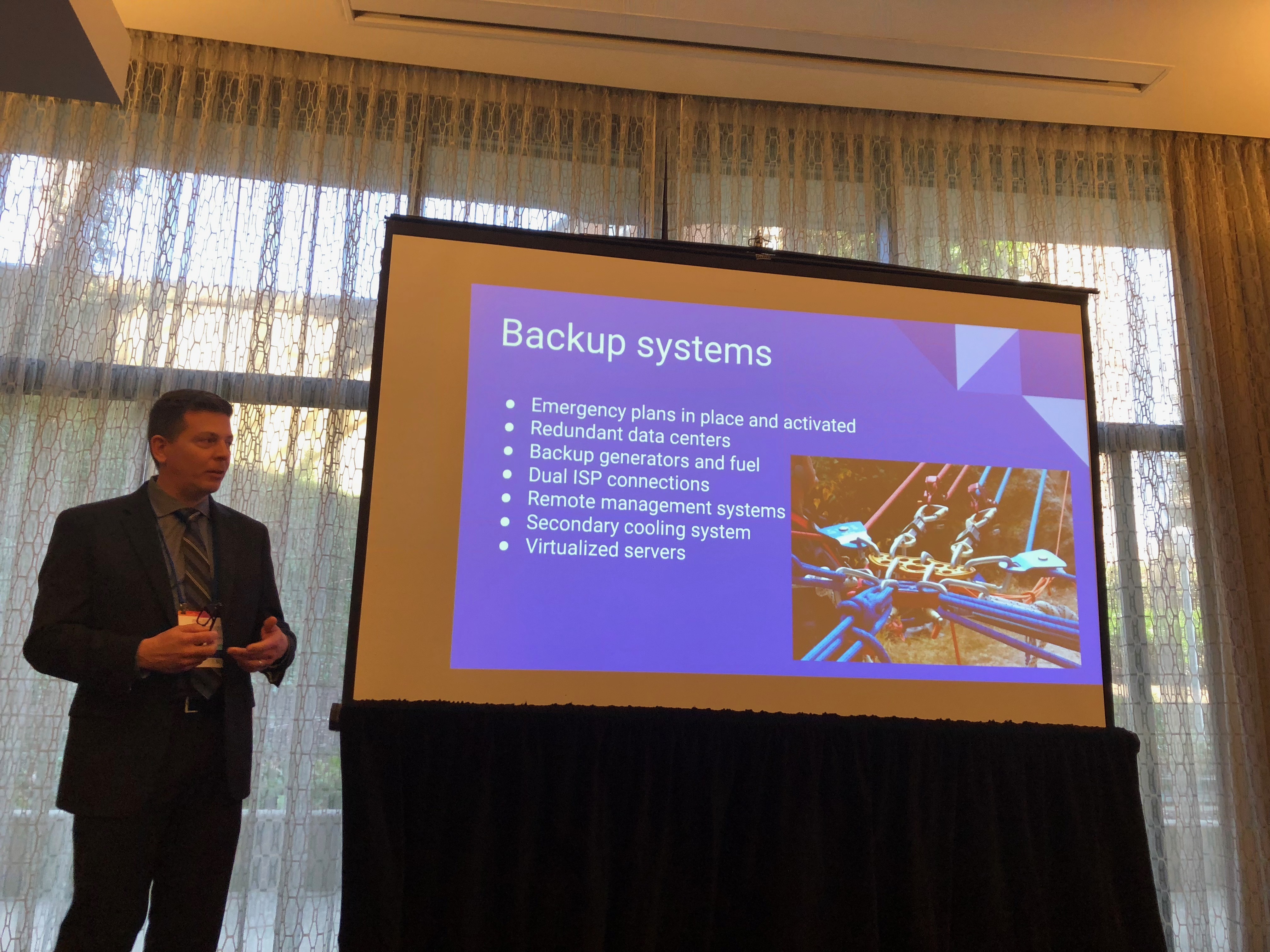 Derek Root speaking at COSN 2018. Photo Credit: Jenny Abamu