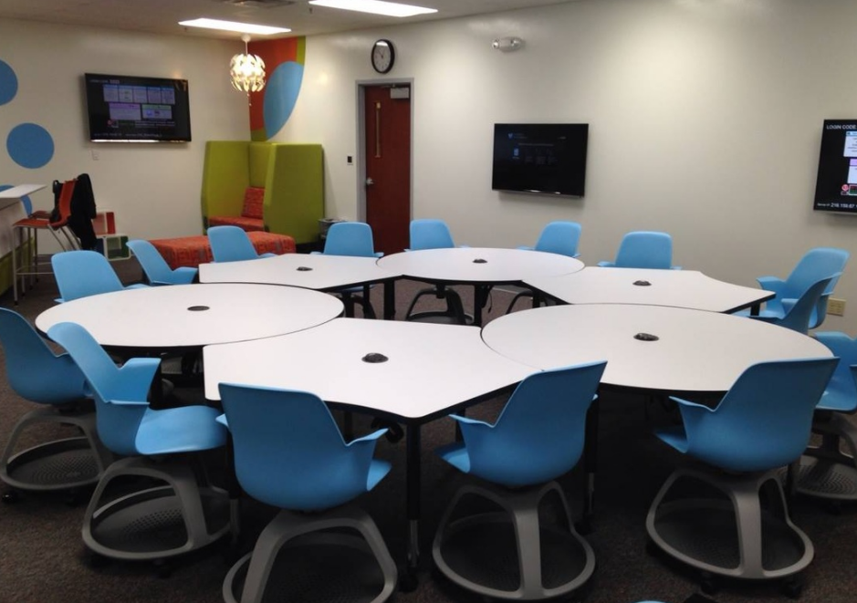For mobility, desks can be arranged into large group "campfires." (Room 21C)