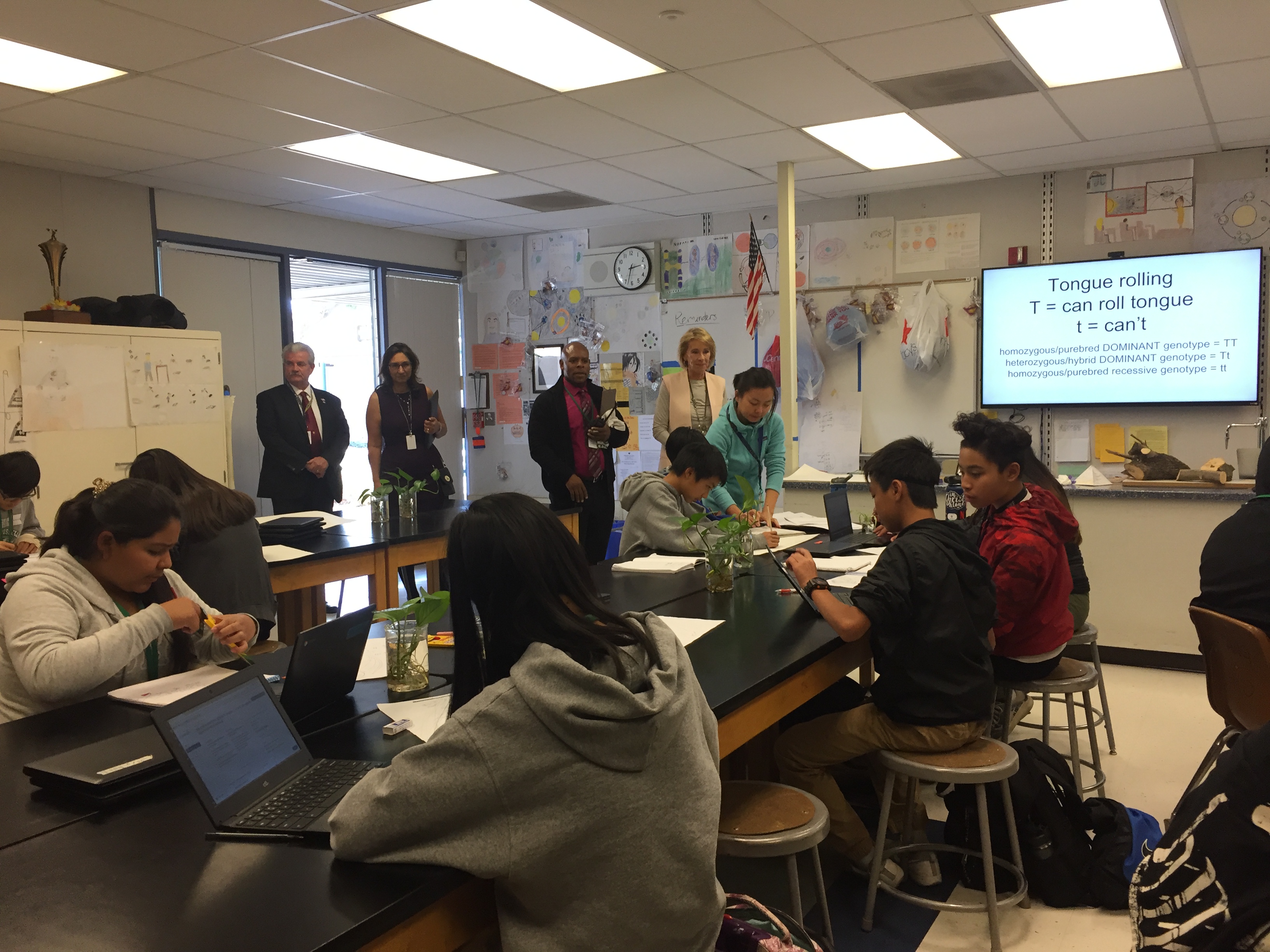 Betsy DeVos enters a science classroom at Thomas Russell Middle School. Photo Credit: Tina Nazerian