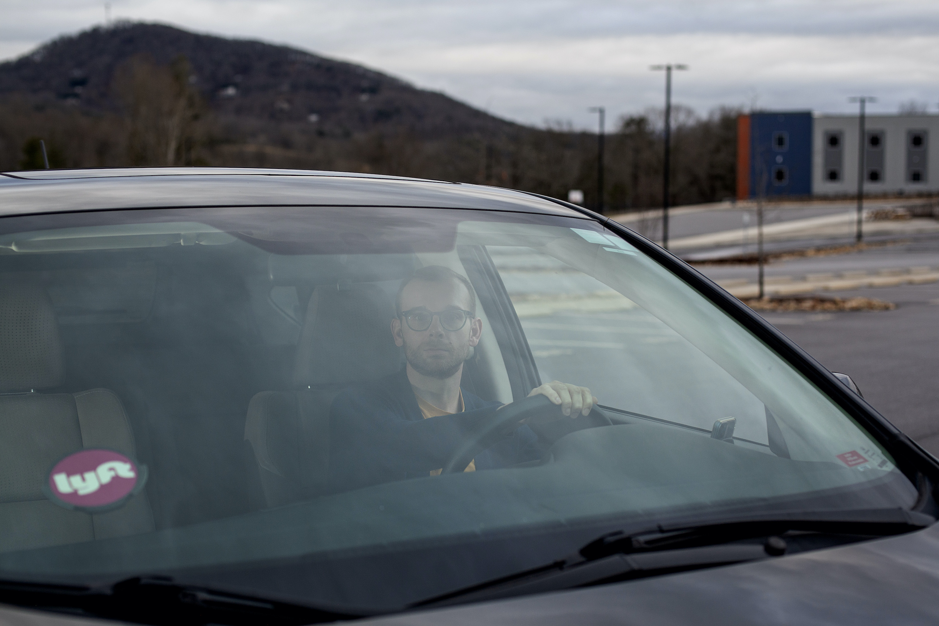 Marcus Blankenship, a sixth grade history teacher, drives for Lyft after school on a Wednesday. Photo by Angela Wilhelm for EdSurge.