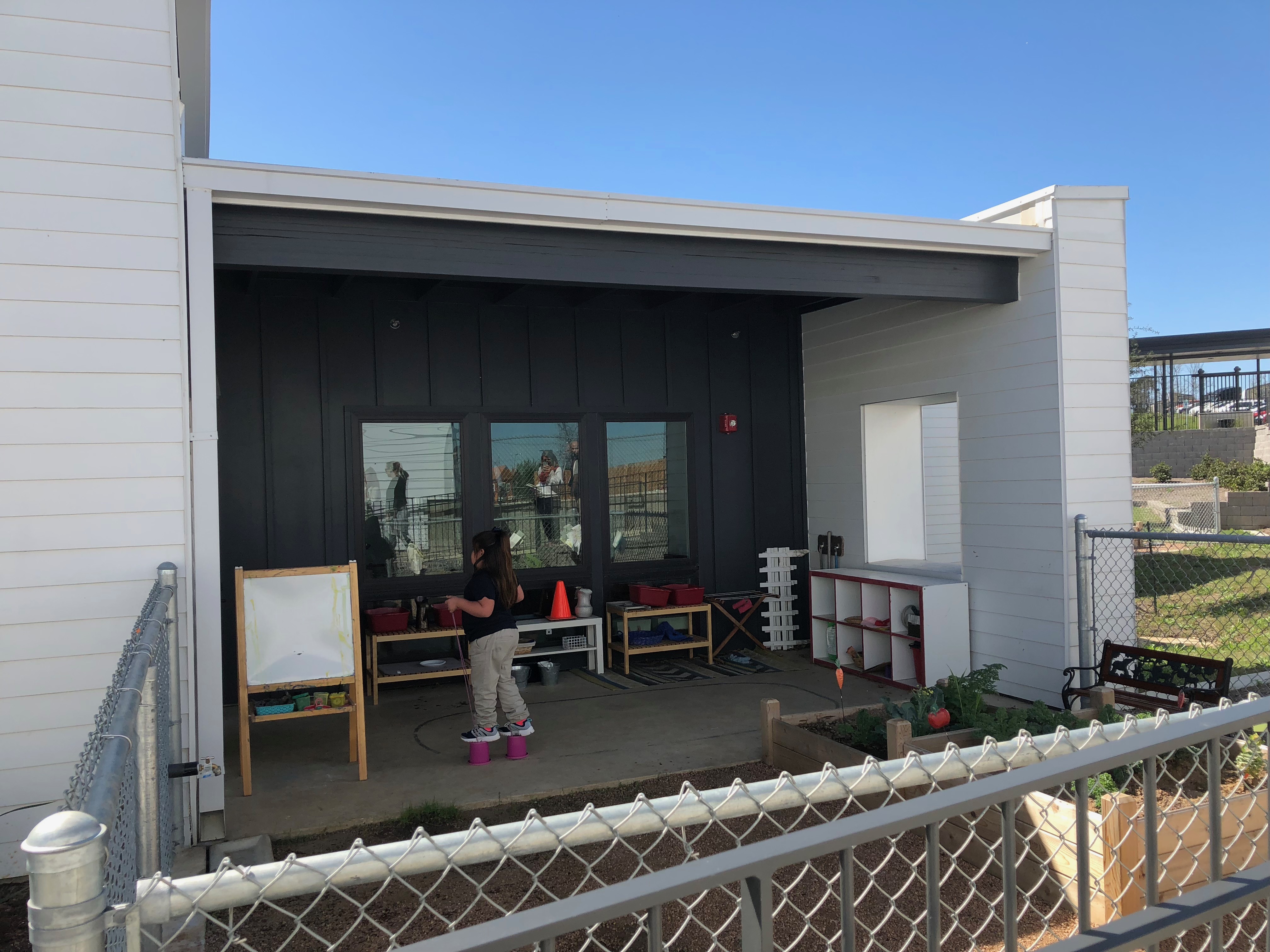 Student in classroom backyard. Photo Credit: Jenny Abamu