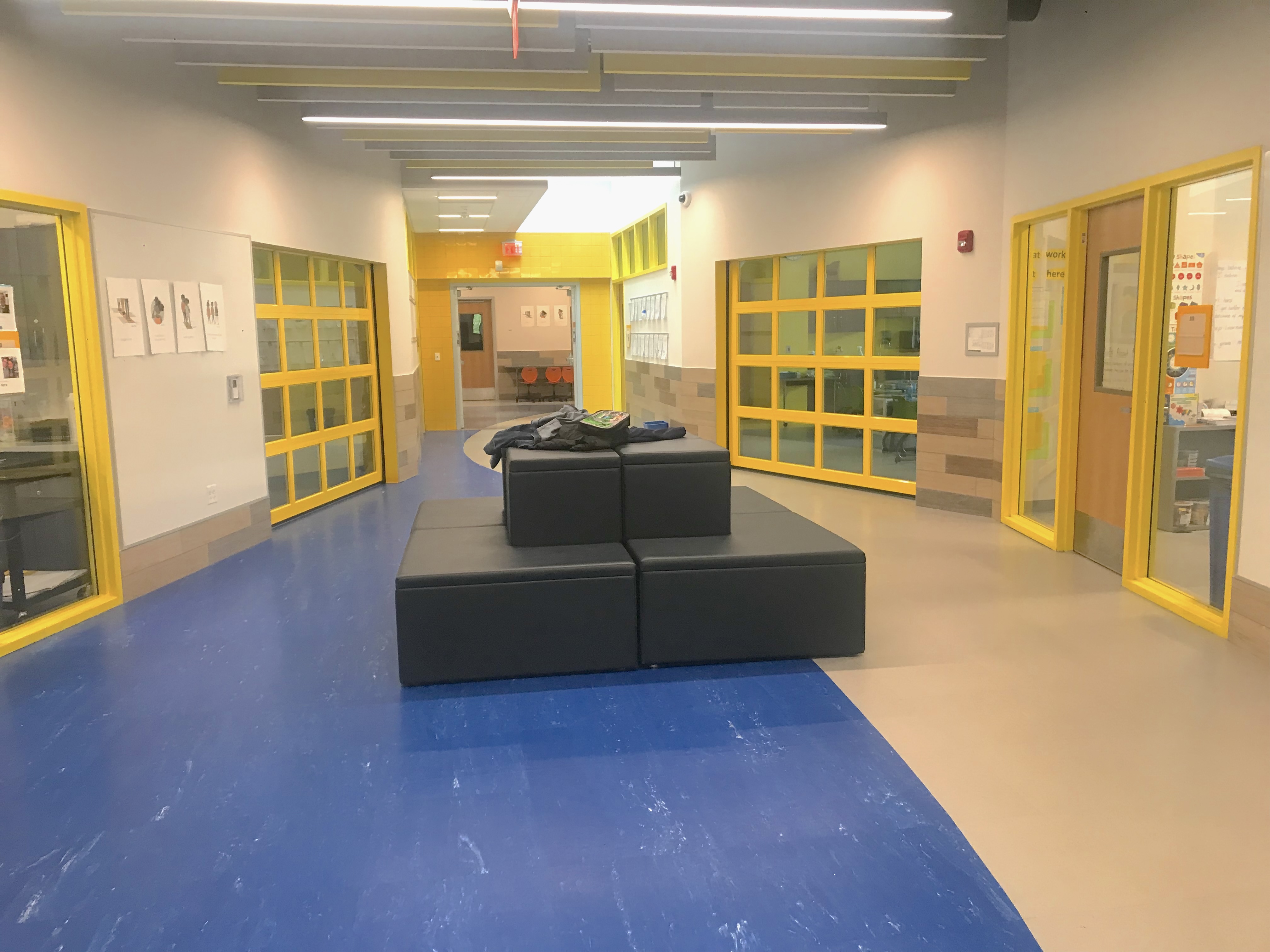Classrooms have garage doors — a nod to the schools’ original Open Education Movement design — that teachers can open when they want their students to collaborate. Photo by Nadia Tamez-Robledo for EdSurge.