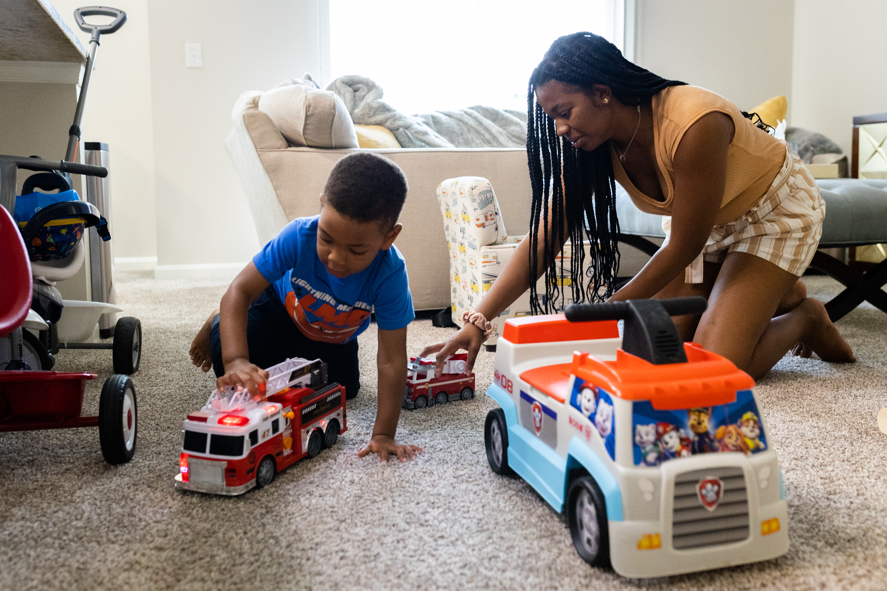 Sarah and Noah play with trucks