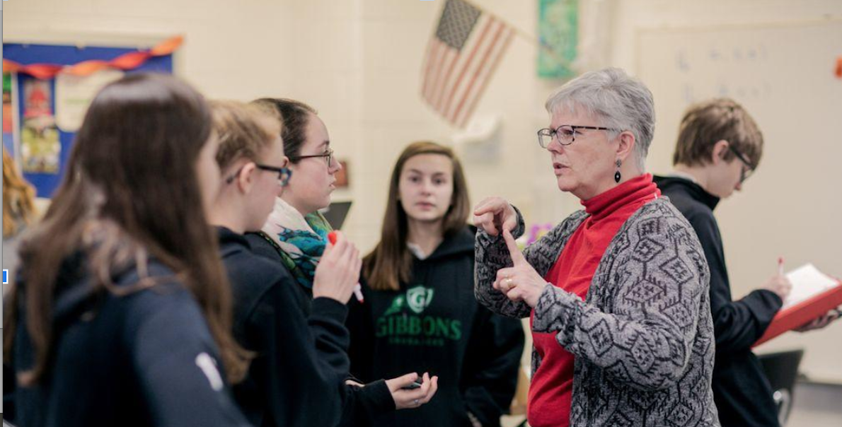 Joan Troy and students at Cardinal Gibbons High. Source: J. Troy.