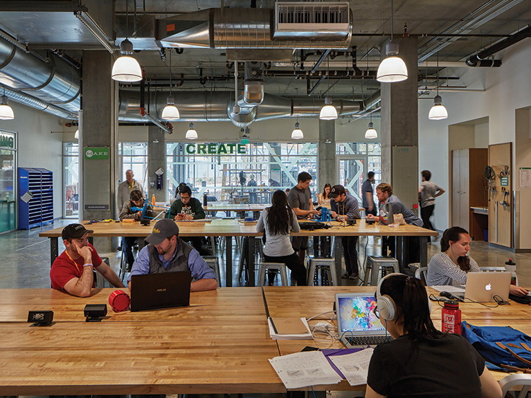 University of Utah students convene in the open-community innovation space on the ground floor of Neeleman Hangar at Lassonde Studios. (Photo credit: Tim Hursley)